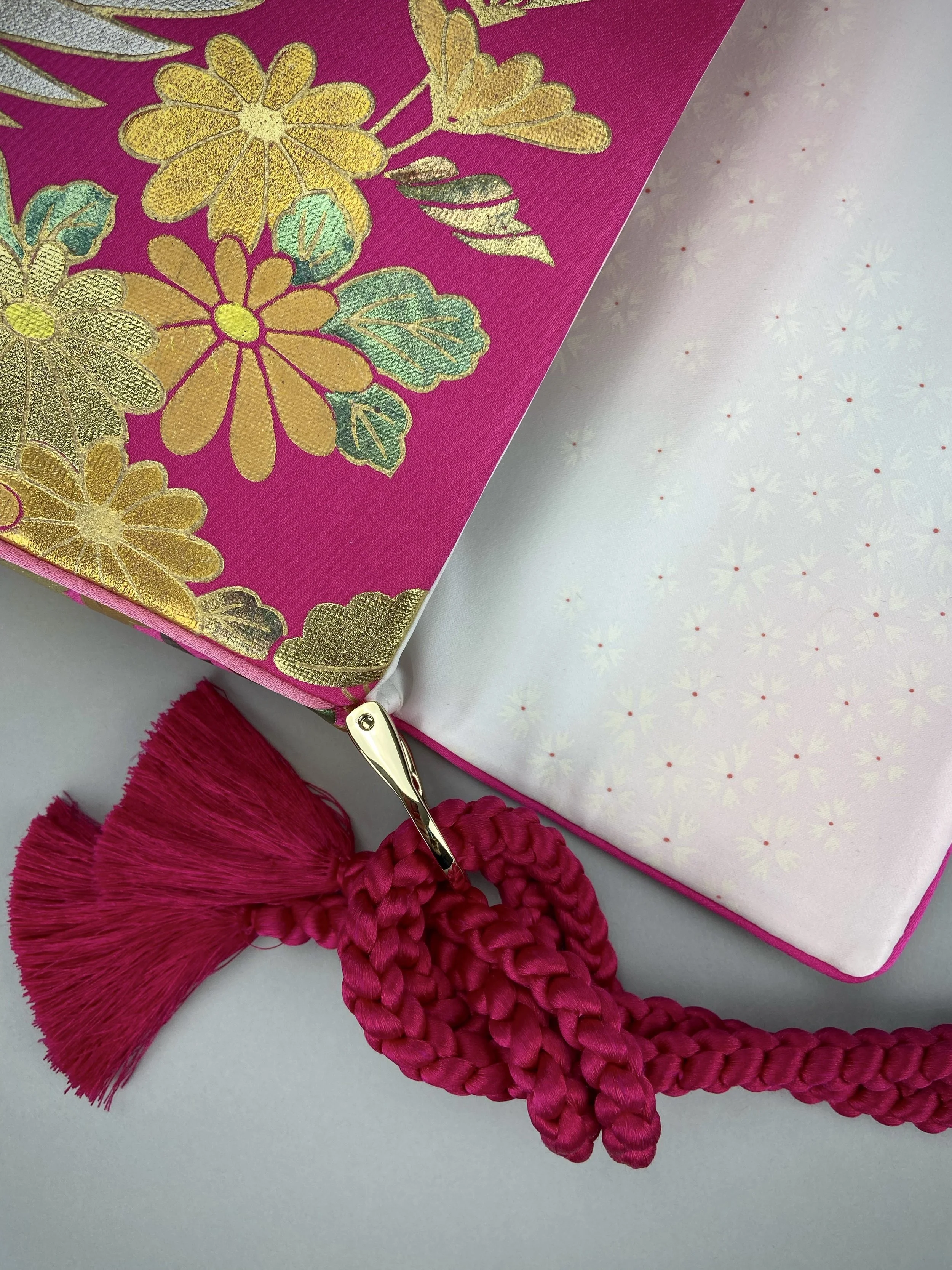 Cherry Pink Crane Feather baguette bag, handmade from vintage Japanese kimono silk with tasseled obijime cord strap by Kirsty Chivers