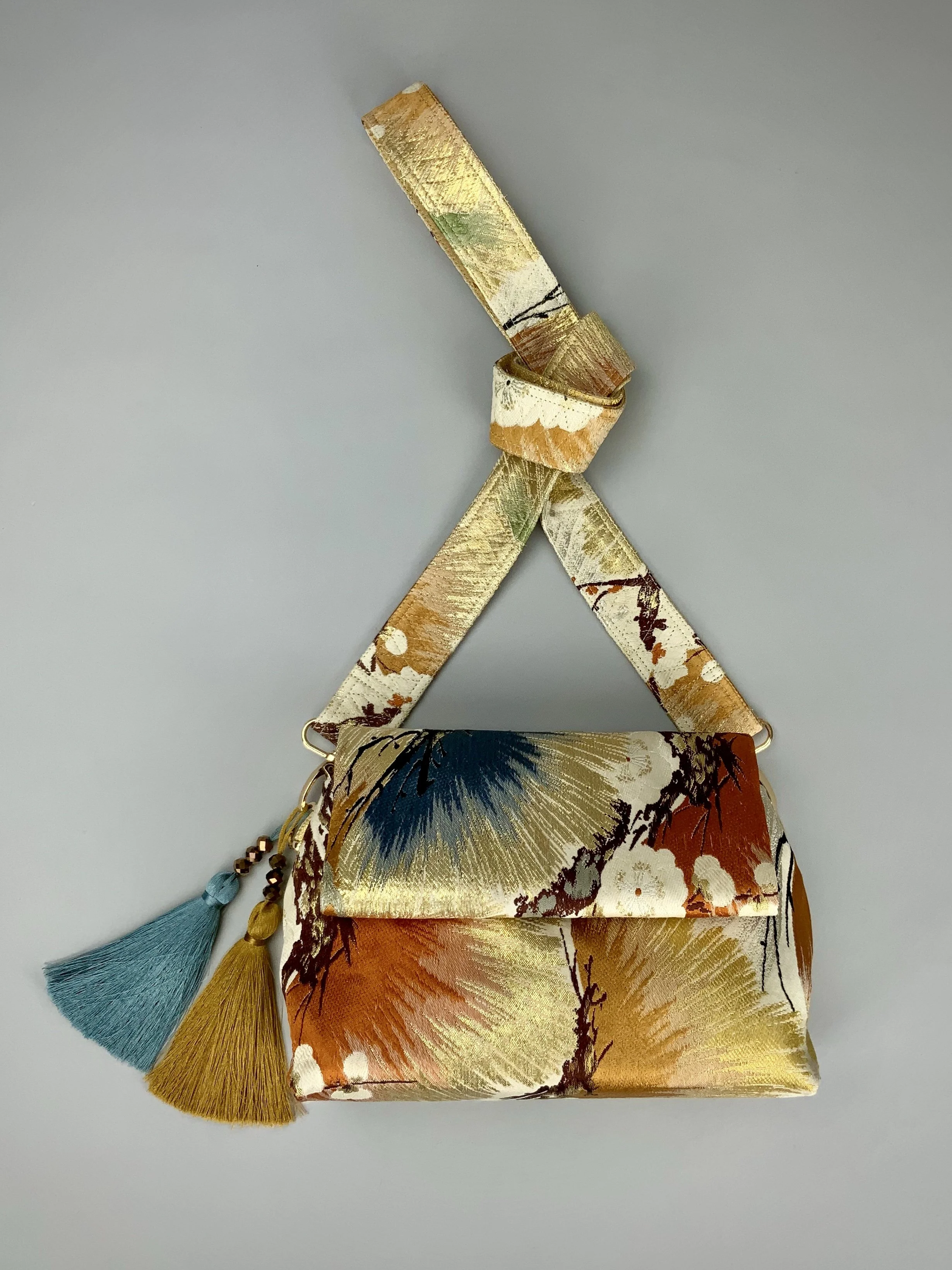 Metallic gold evening bag with Matsu pine and blossom design, made from vintage obi silk by Kirsty Chivers