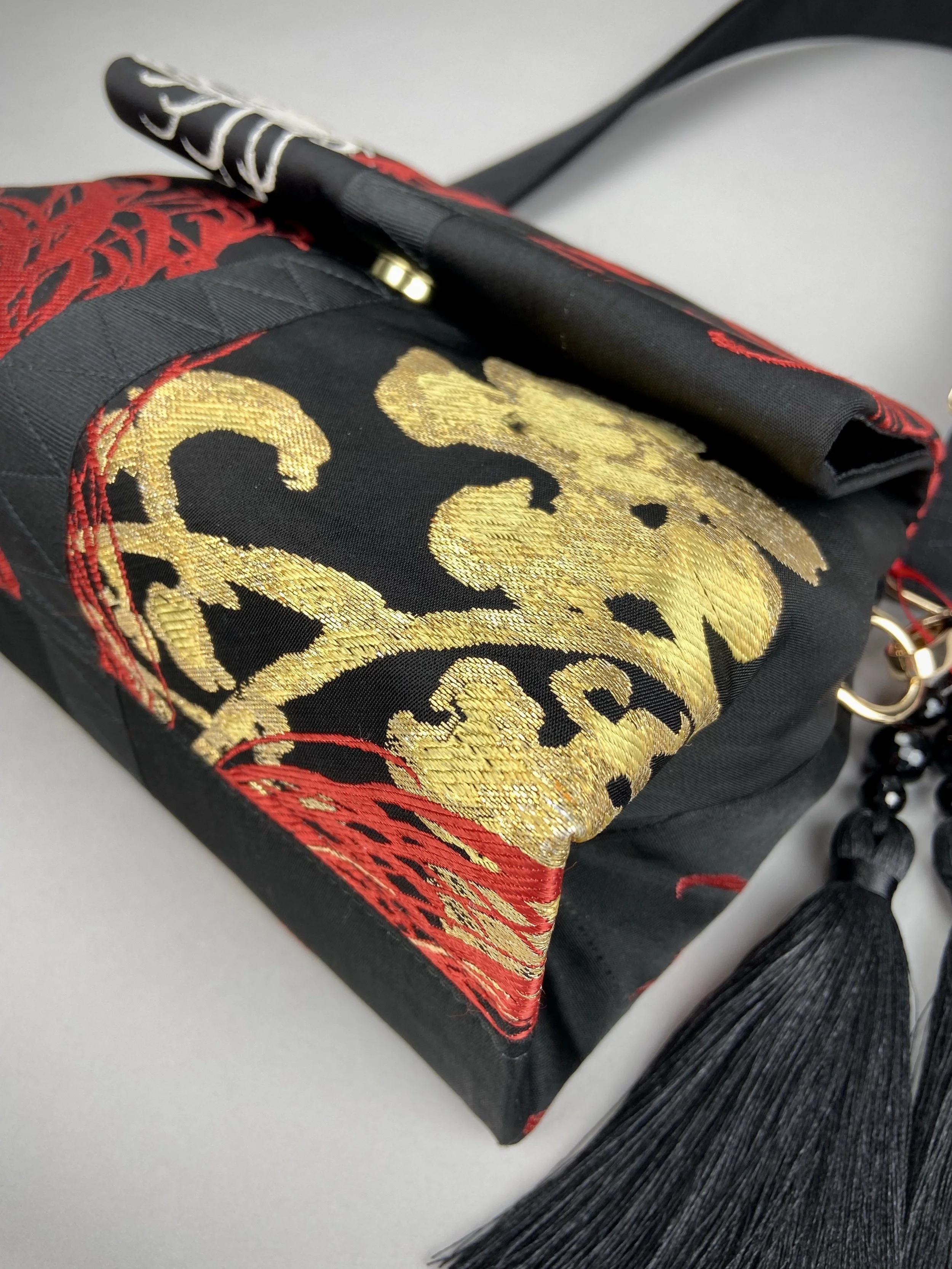 Black Chrysanthemum vintage obi silk and rayon fold bag with gold hardware and black silk tassel charm by Kirsty Chivers
