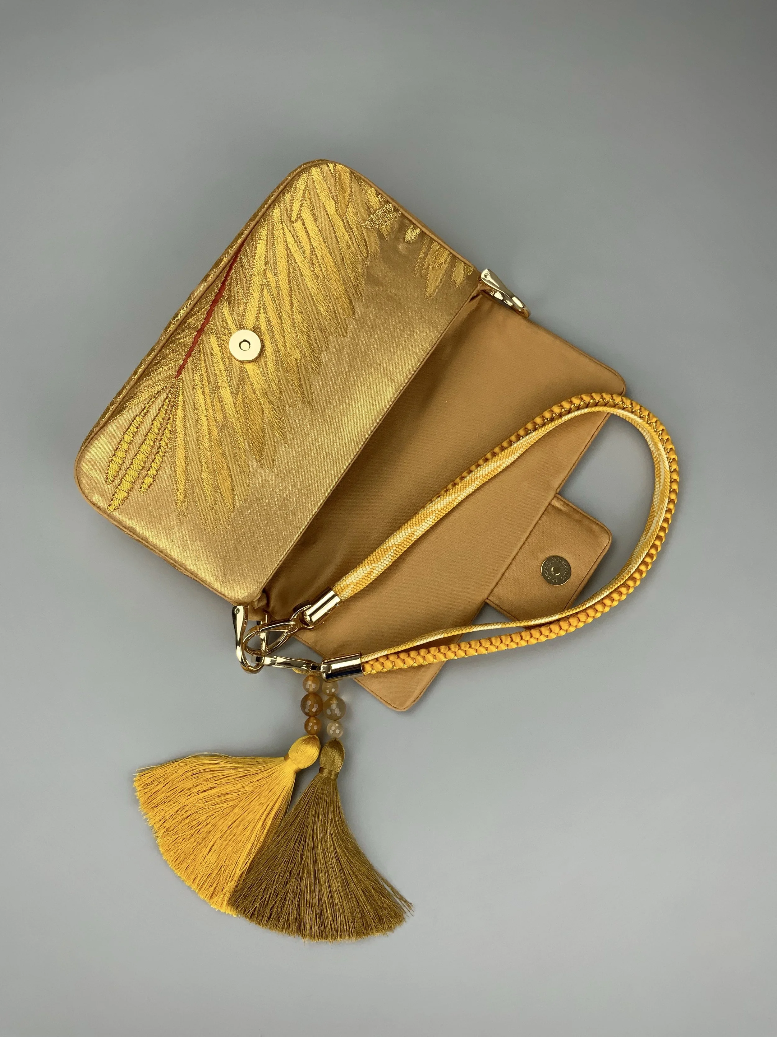 Lustrous metallic gold baguette evening bag made from vintage Japanese obi silk by Kirsty Chivers