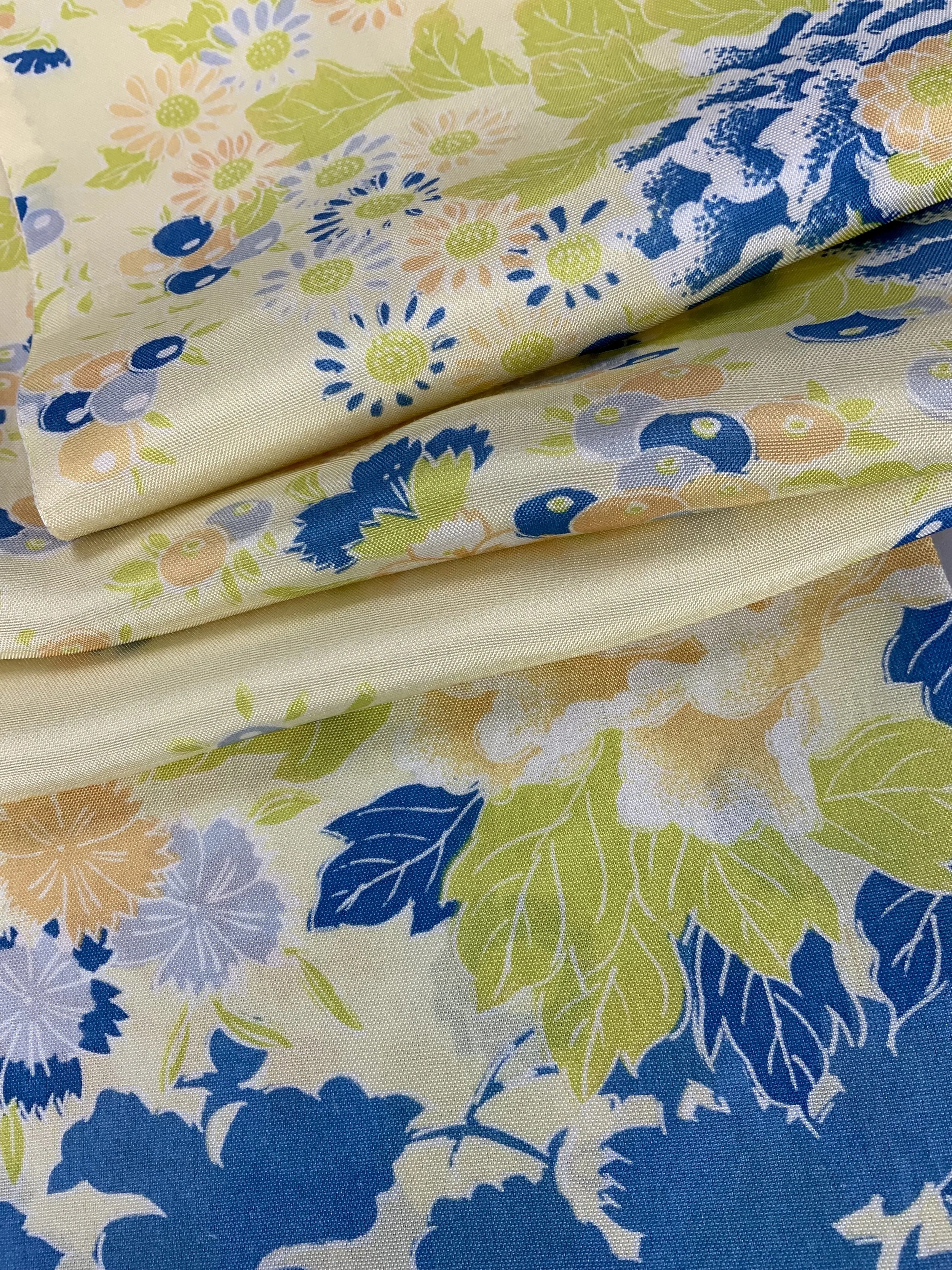 Closeup of yellow scarf with blossom print handmade from kimono fabric and silk satin by Kirsty Chivers