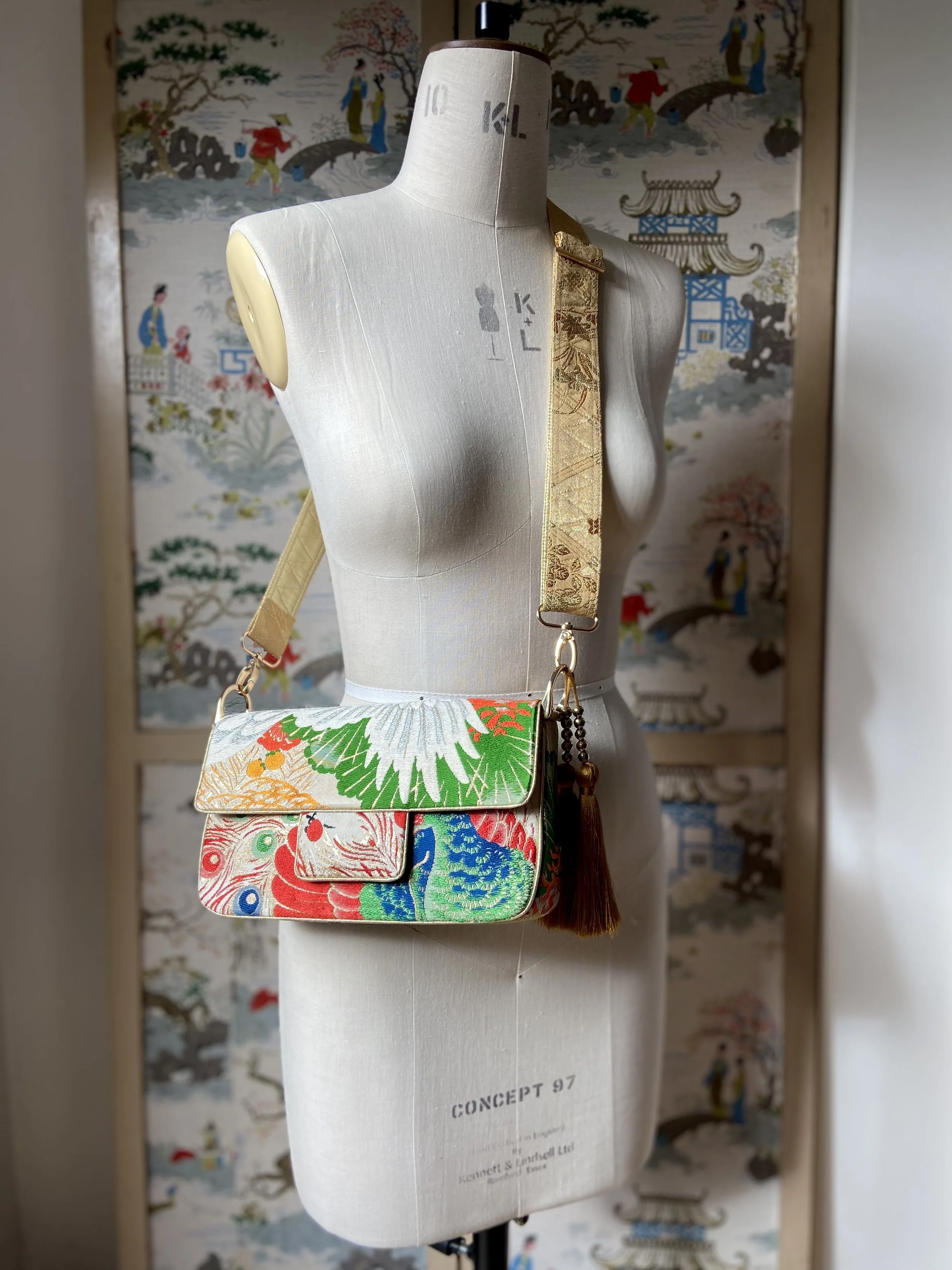 Unique evening bag in vintage obi silk with peacock, pine motifs & gold accents by Kirsty Chivers