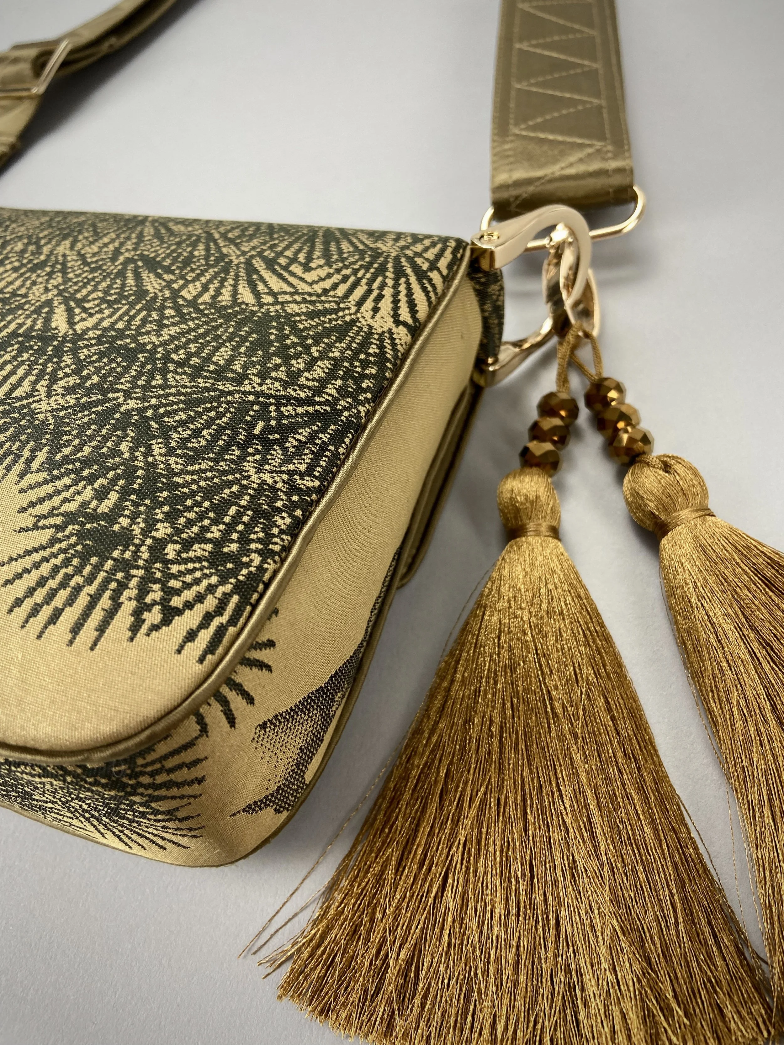 Unique Matsu pine baguette bag, made from vintage Japanese obi silk, with crane design, gold hardware and matching tassel charms by Kirsty Chivers
