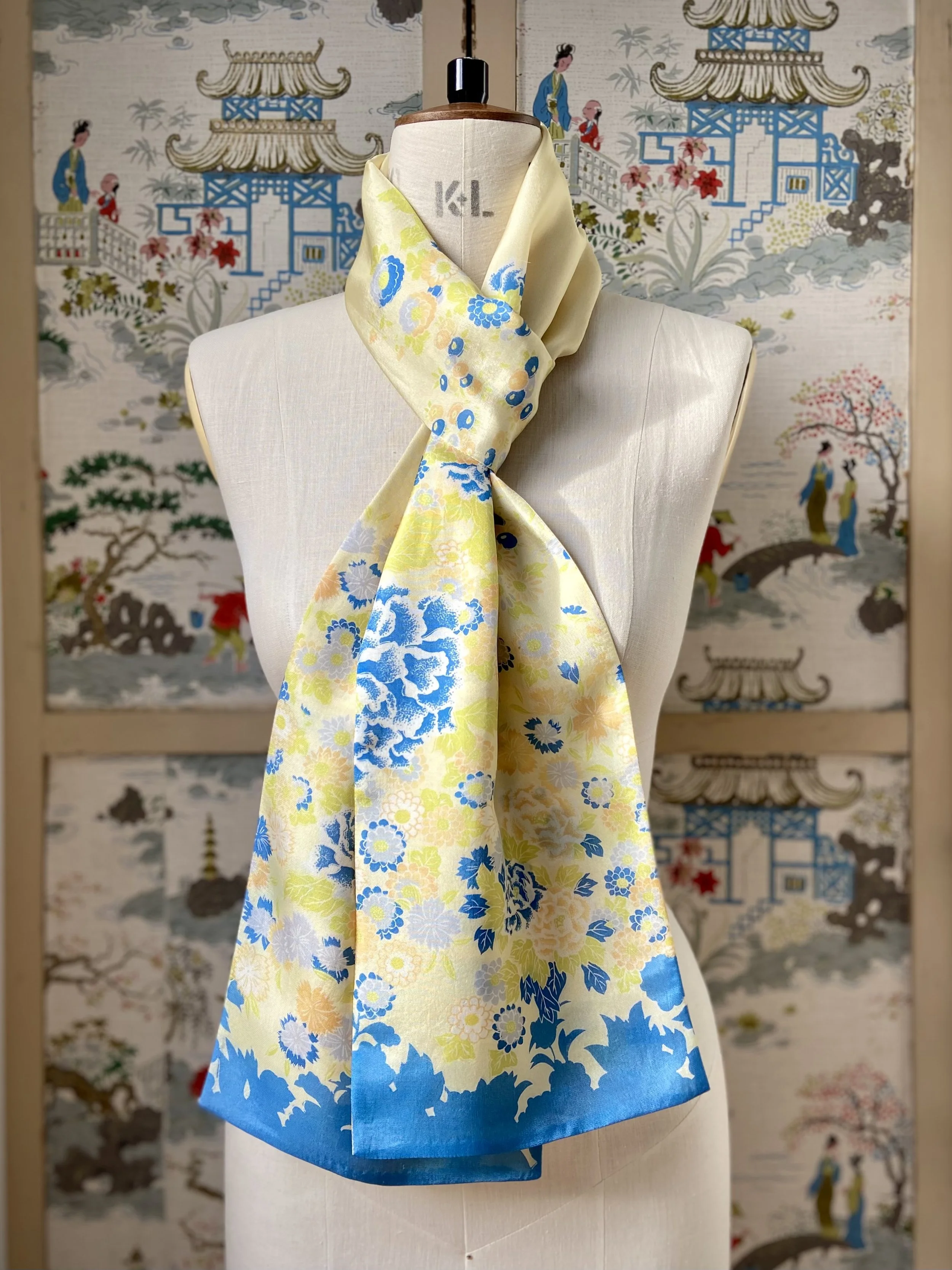 Yellow scarf with blossom print, presented on a dress stand, handmade from vintage kimono fabric and silk satin by Kirsty Chivers