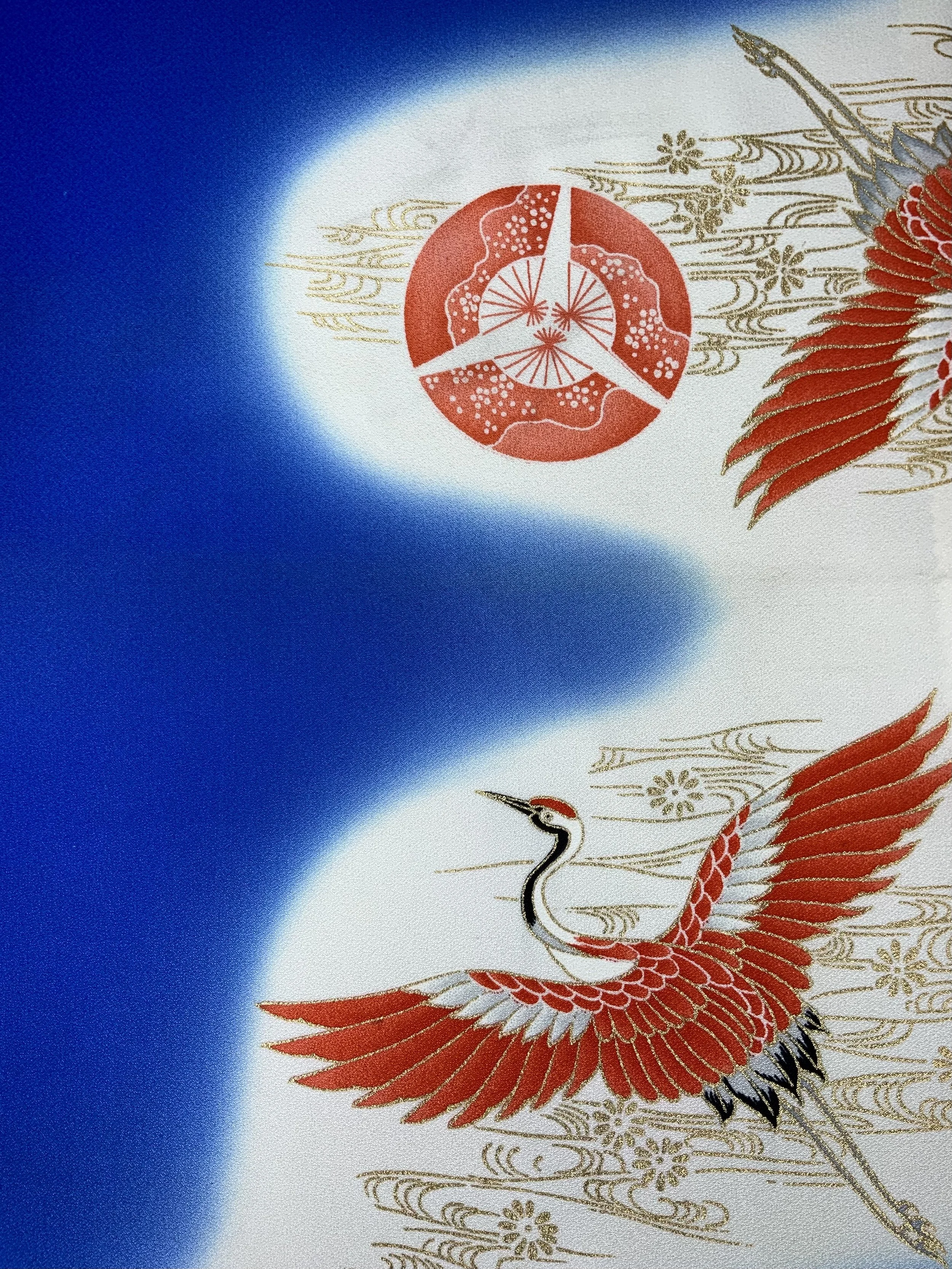 Closeup of electric blue silk scarf with Flying Crane print handmade by Kirsty Chivers