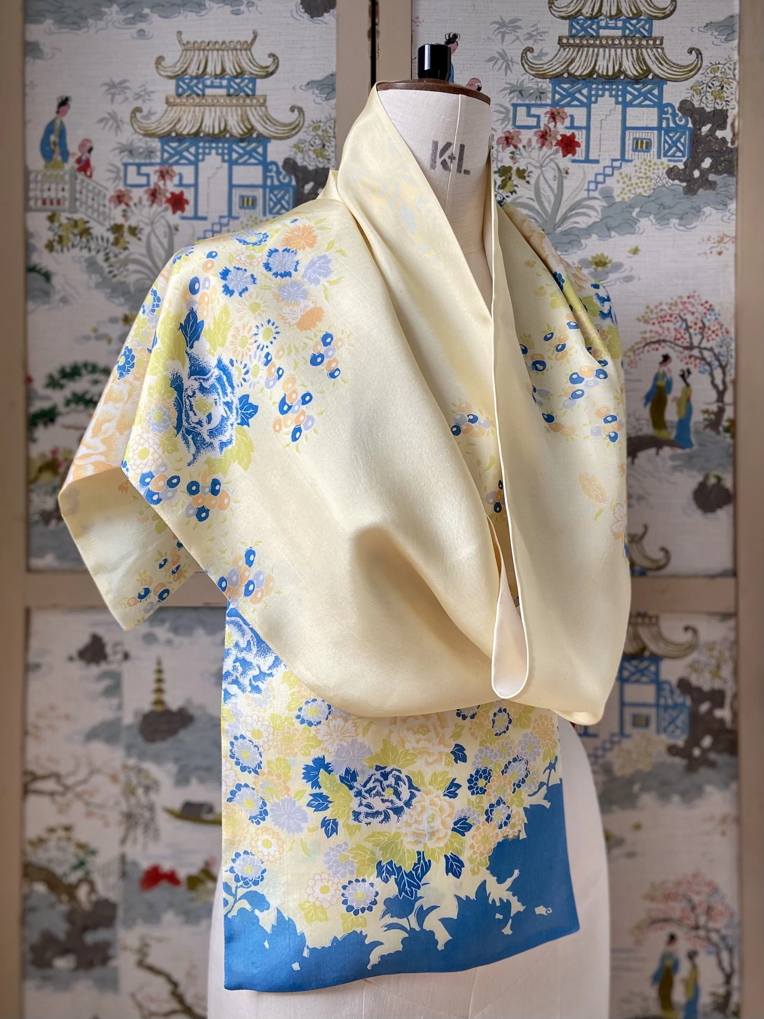 Yellow scarf with blossom print, presented on a dress stand, handmade from vintage kimono fabric and silk satin by Kirsty Chivers