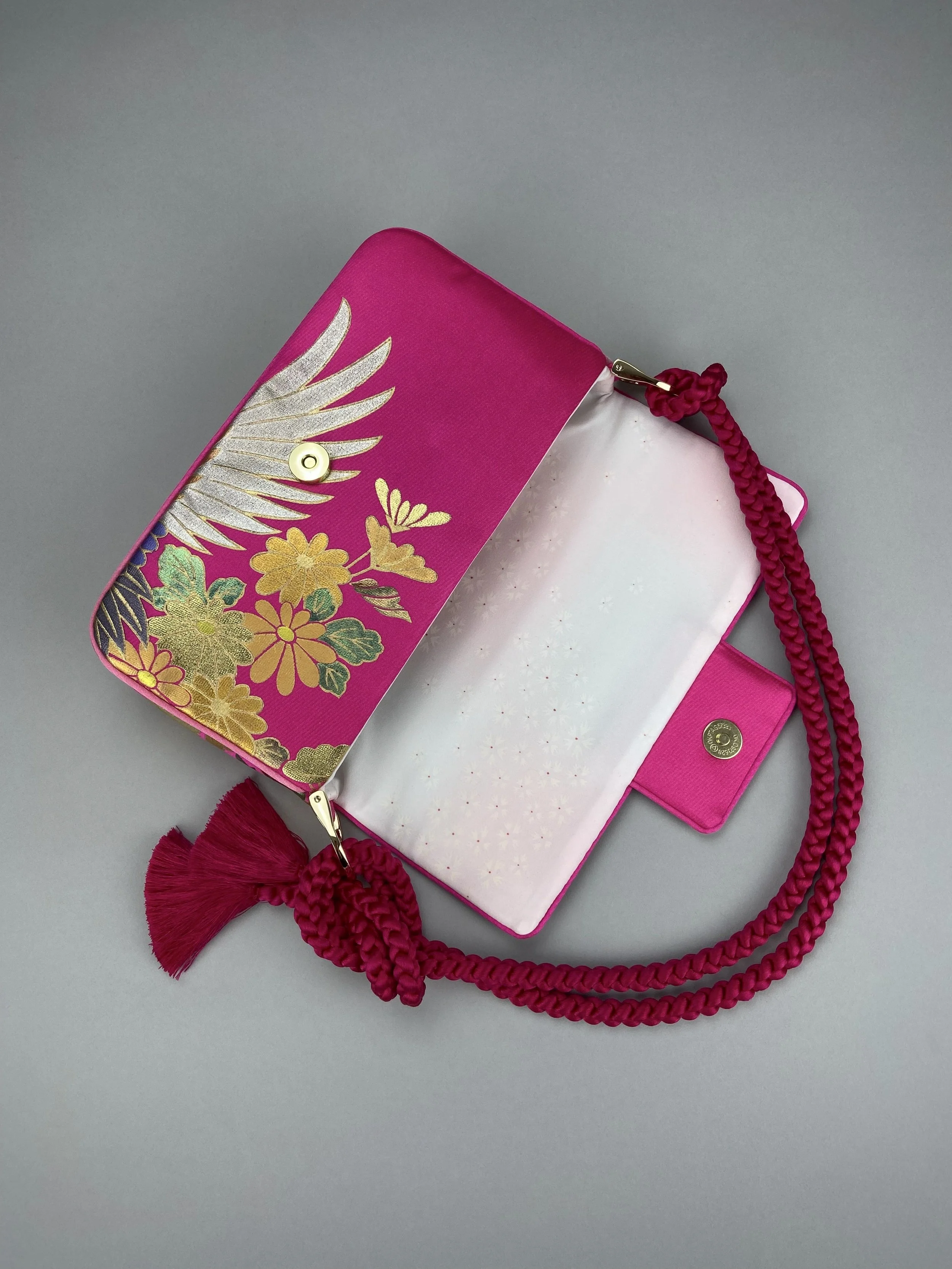 Cherry Pink Crane Feather baguette bag, handmade from vintage Japanese kimono silk with tasseled obijime cord strap by Kirsty Chivers
