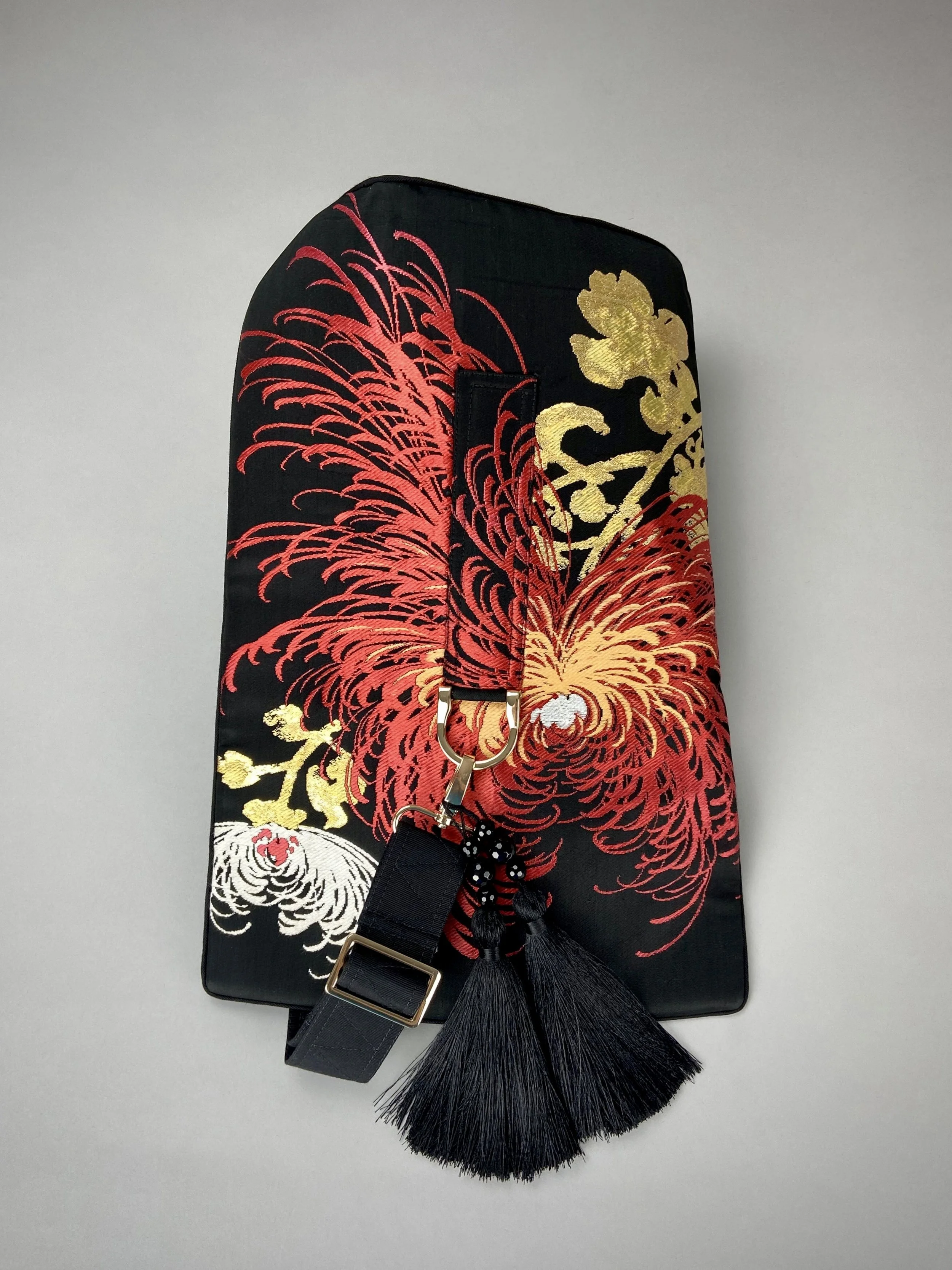 Black and crimson Chrysanthemum vintage obi silk shoulder bag with gold thread detail and black silk tassel charm by Kirsty Chivers