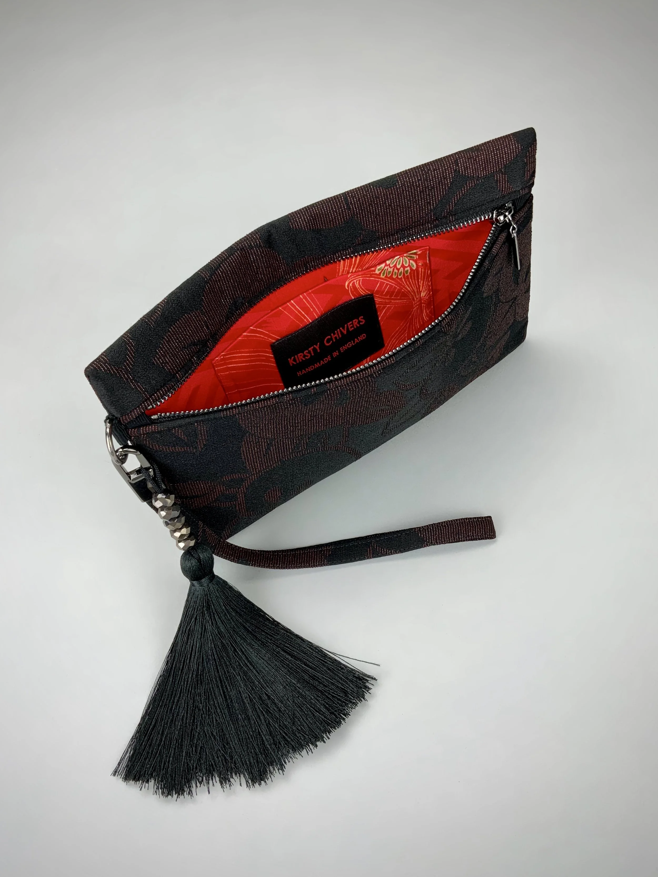 Interior of glittery black wristlet clutch purse with tassel, handmade from vintage Japanese kimono silk