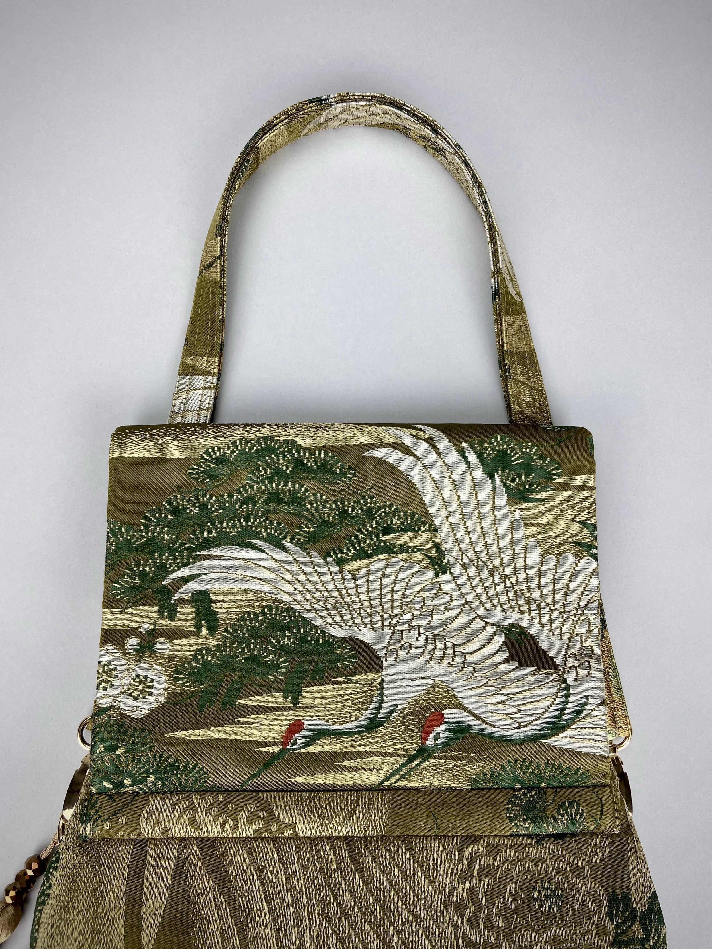 Green Flying Crane evening bag, made from repurposed vintage Japanese obi silk by Kirsty Chivers