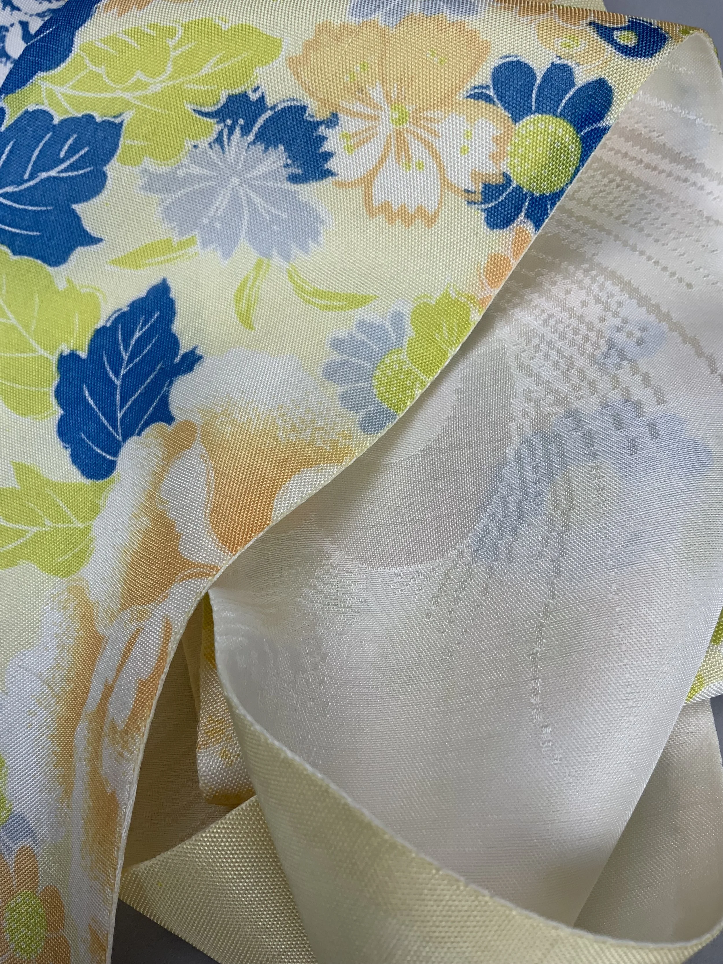 Closeup of pale yellow skinny scarf with blossom print handmade from vintage kimono fabric by Kirsty Chivers
