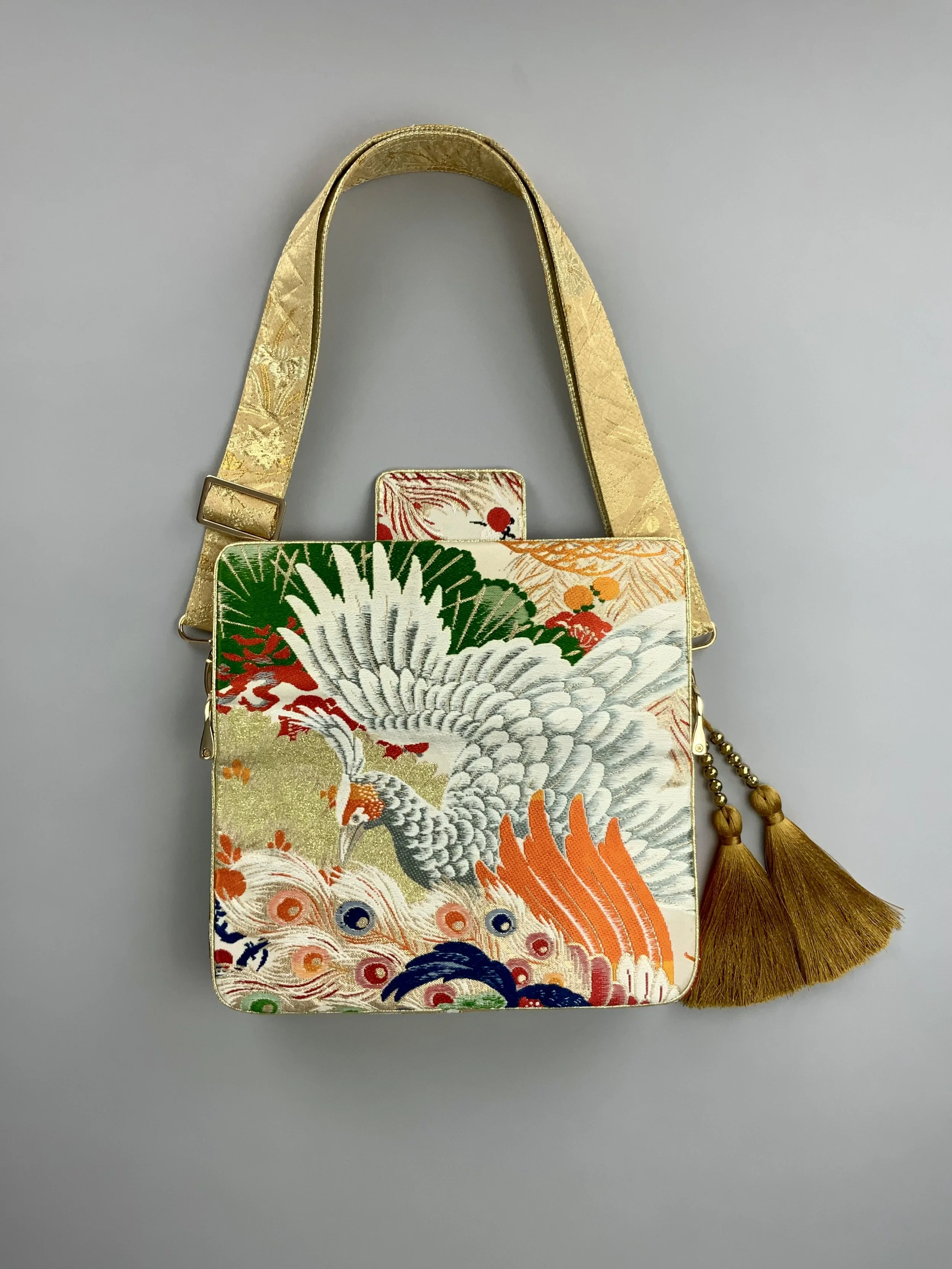 Unique evening bag in vintage obi silk with peacock, pine motifs & gold accents by Kirsty Chivers