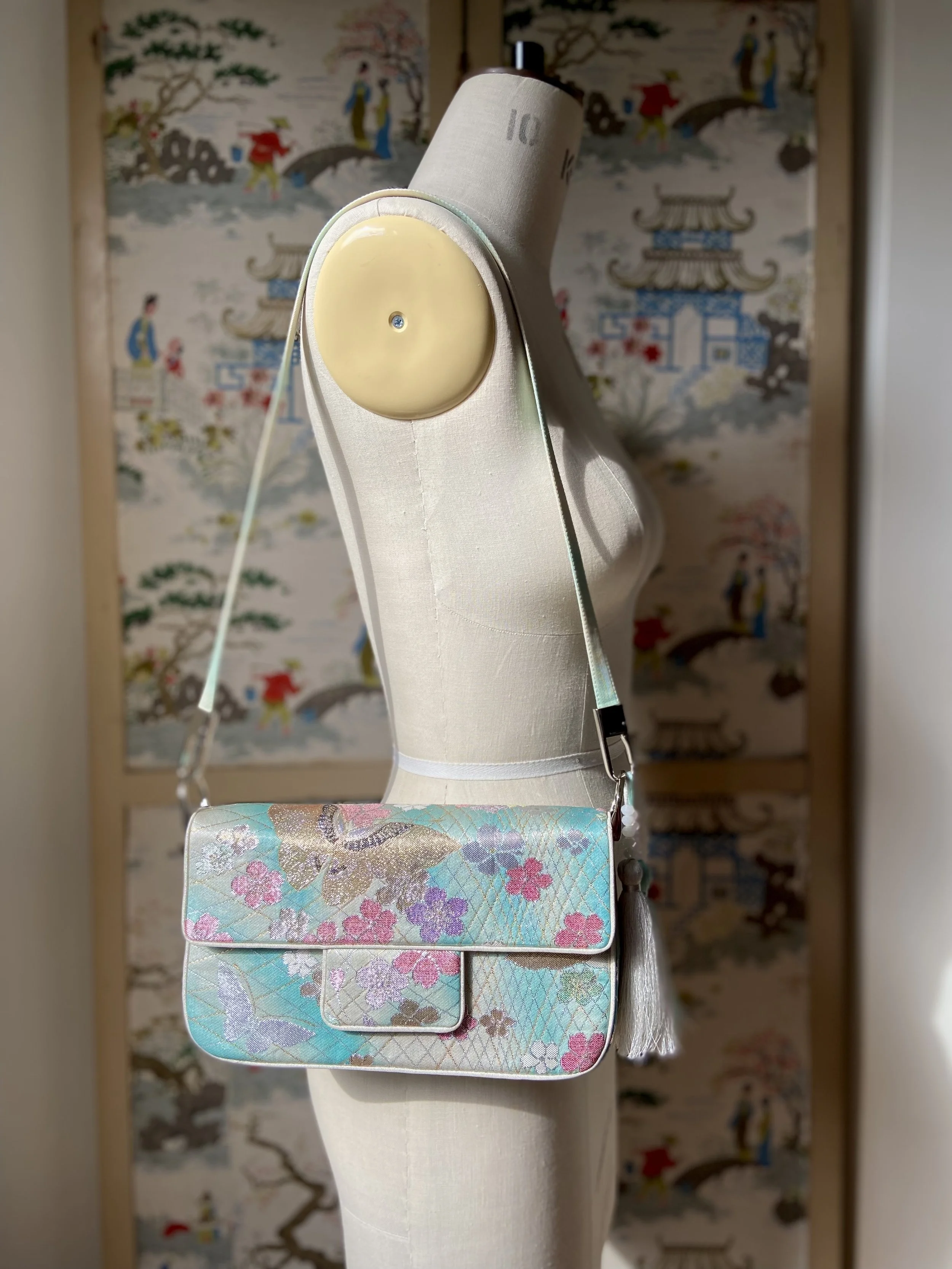 Aqua blue ombre evening bag made from vintage obi silk with pastel gold butterfly and blossom design by Kirsty Chivers