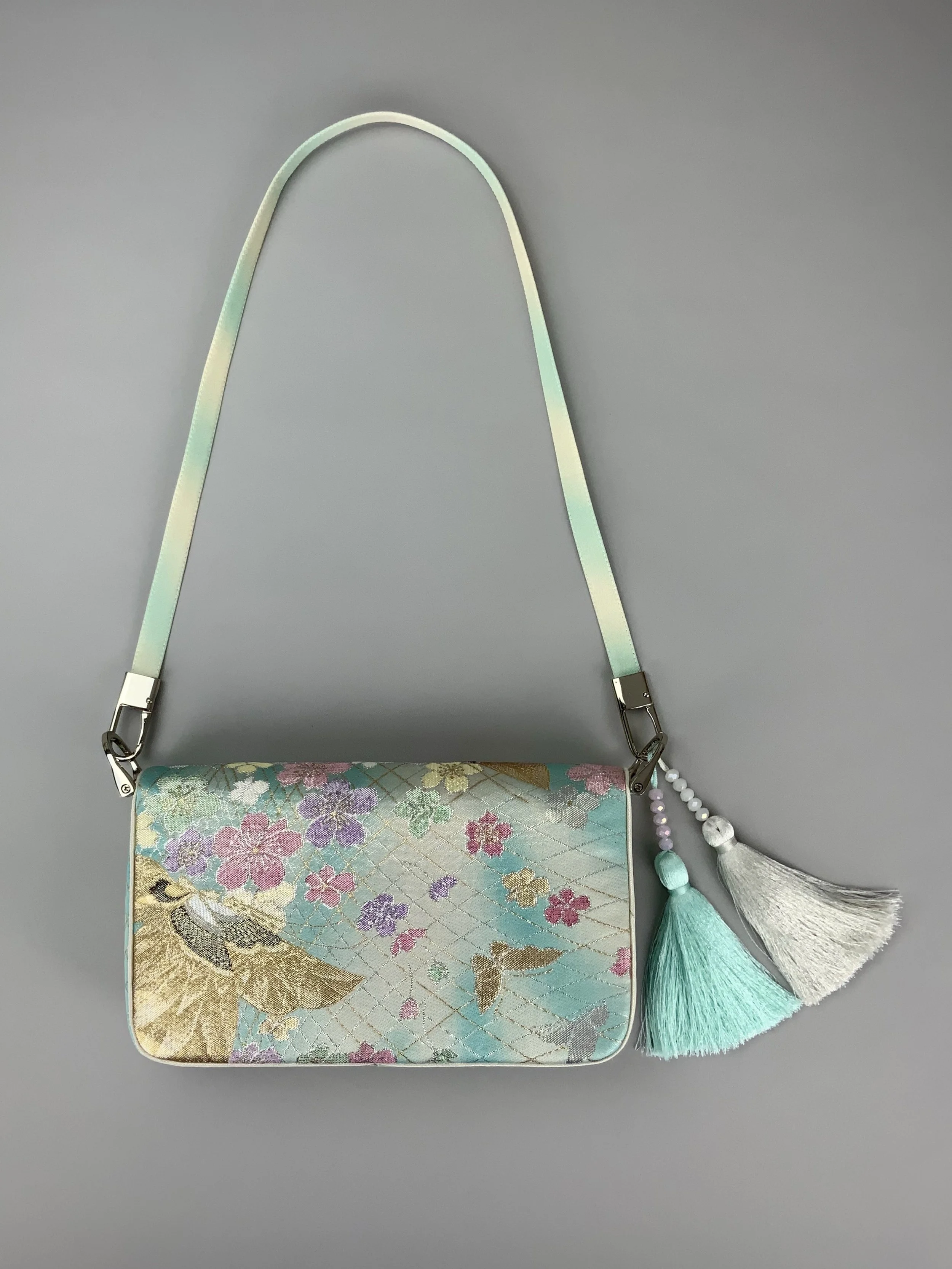 Aqua blue ombre evening bag made from vintage obi silk with pastel gold butterfly and blossom design by Kirsty Chivers
