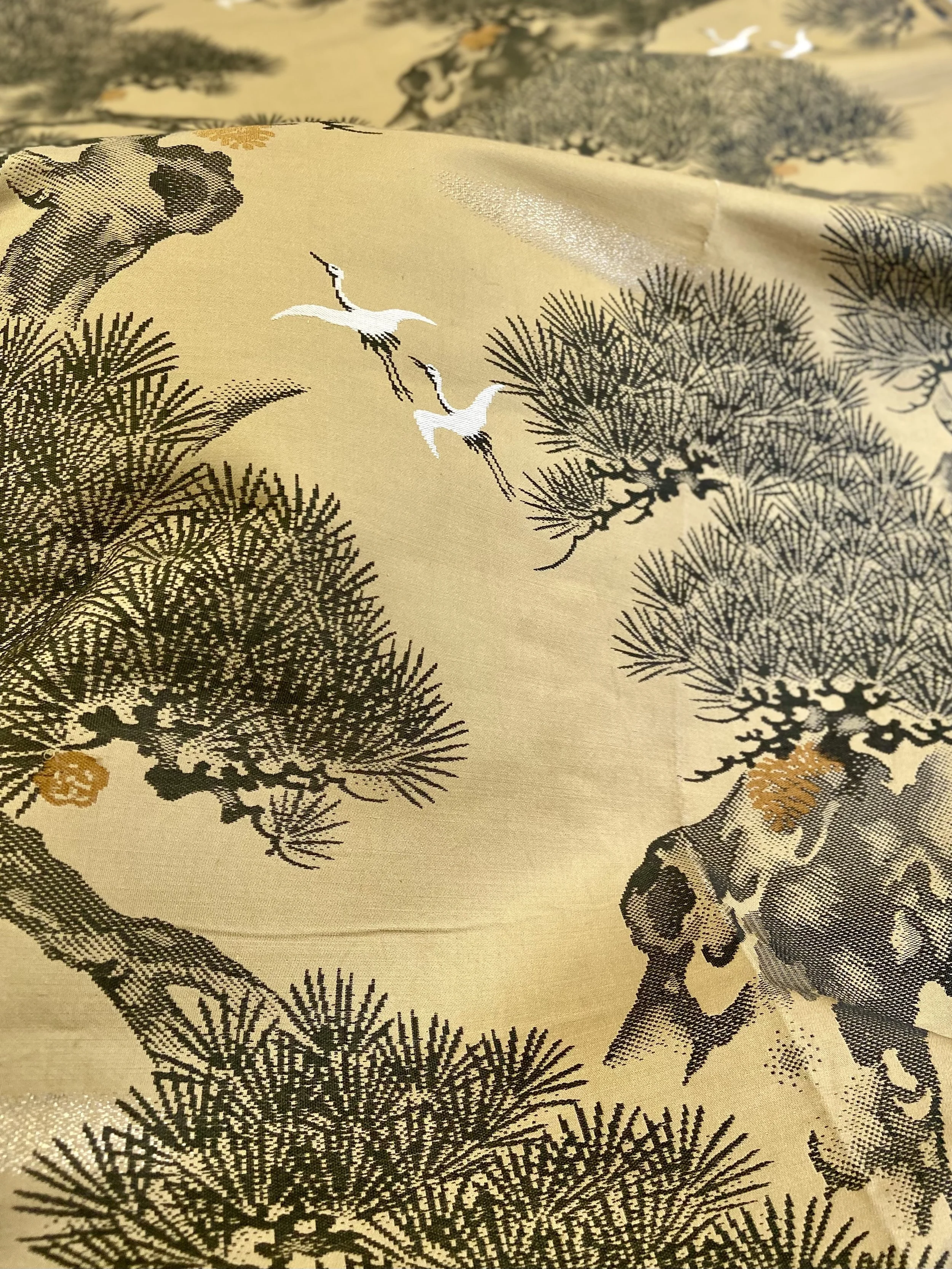 Unique Matsu pine baguette bag, made from vintage Japanese obi silk, with crane design, gold hardware and matching tassel charms by Kirsty Chivers