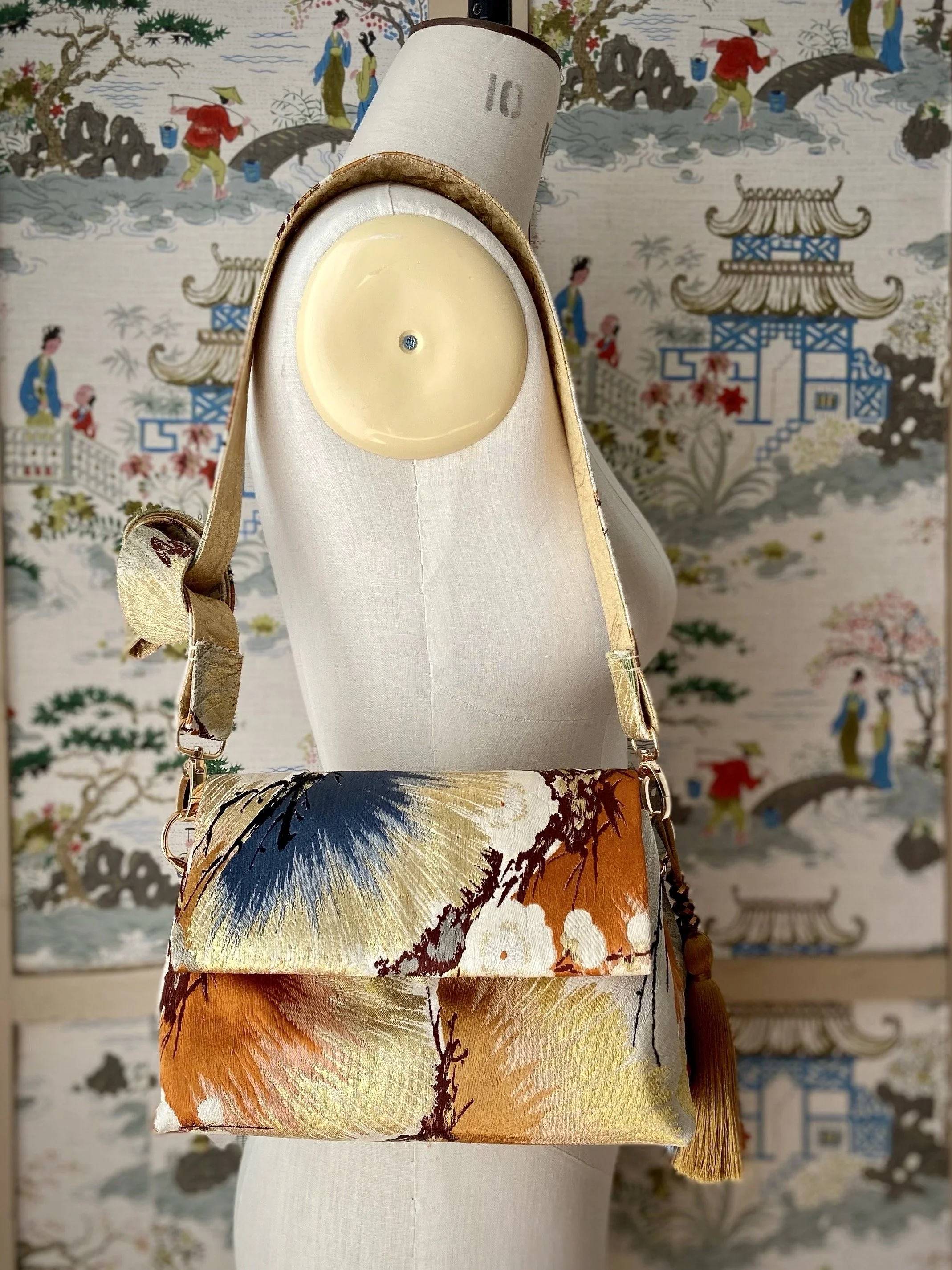 Metallic gold evening bag with Matsu pine and blossom design, made from vintage obi silk by Kirsty Chivers