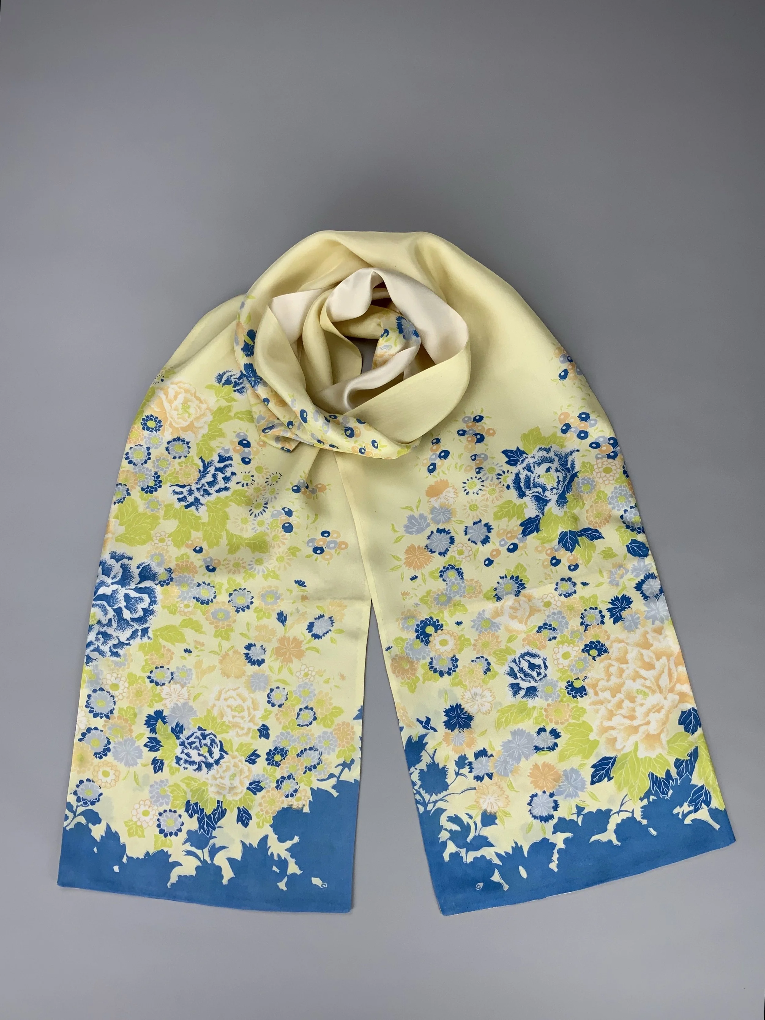 Flatlay of yellow scarf with blossom print handmade from kimono fabric and silk satin by Kirsty Chivers