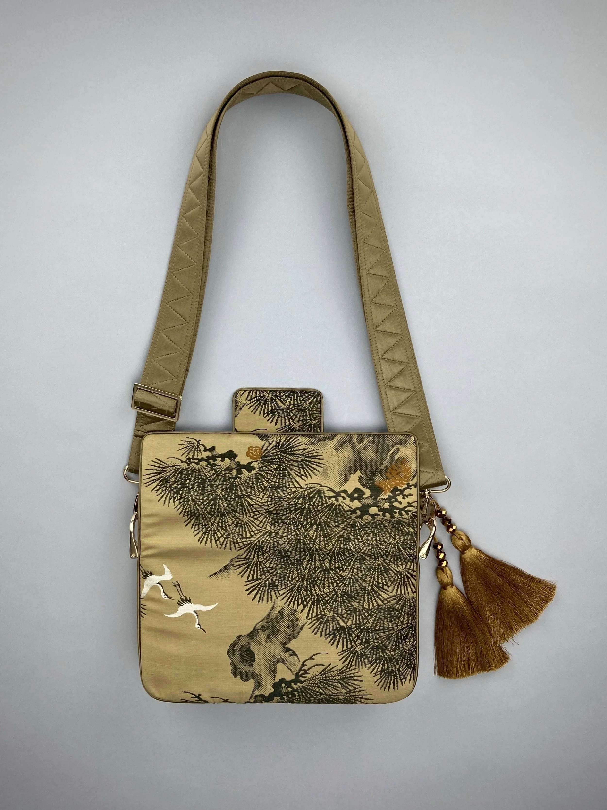 Unique Matsu pine baguette bag, made from vintage Japanese obi silk, with crane design, gold hardware and matching tassel charms by Kirsty Chivers