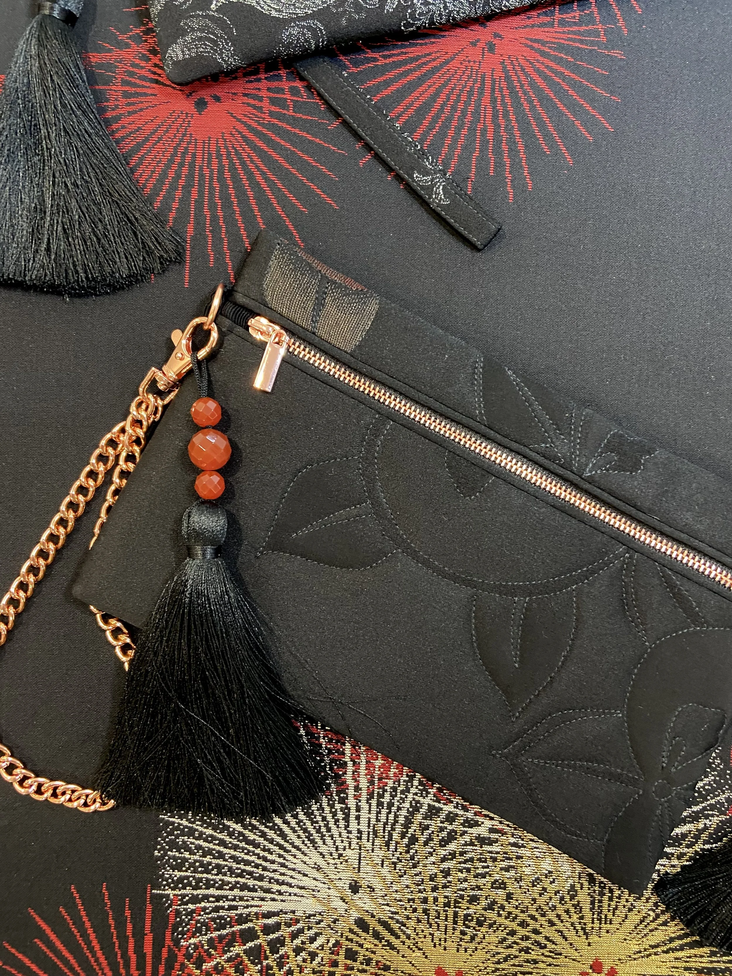 Quilted black clutch purse with tassel & Carnelian beads, made from vintage Japanese kimono silk