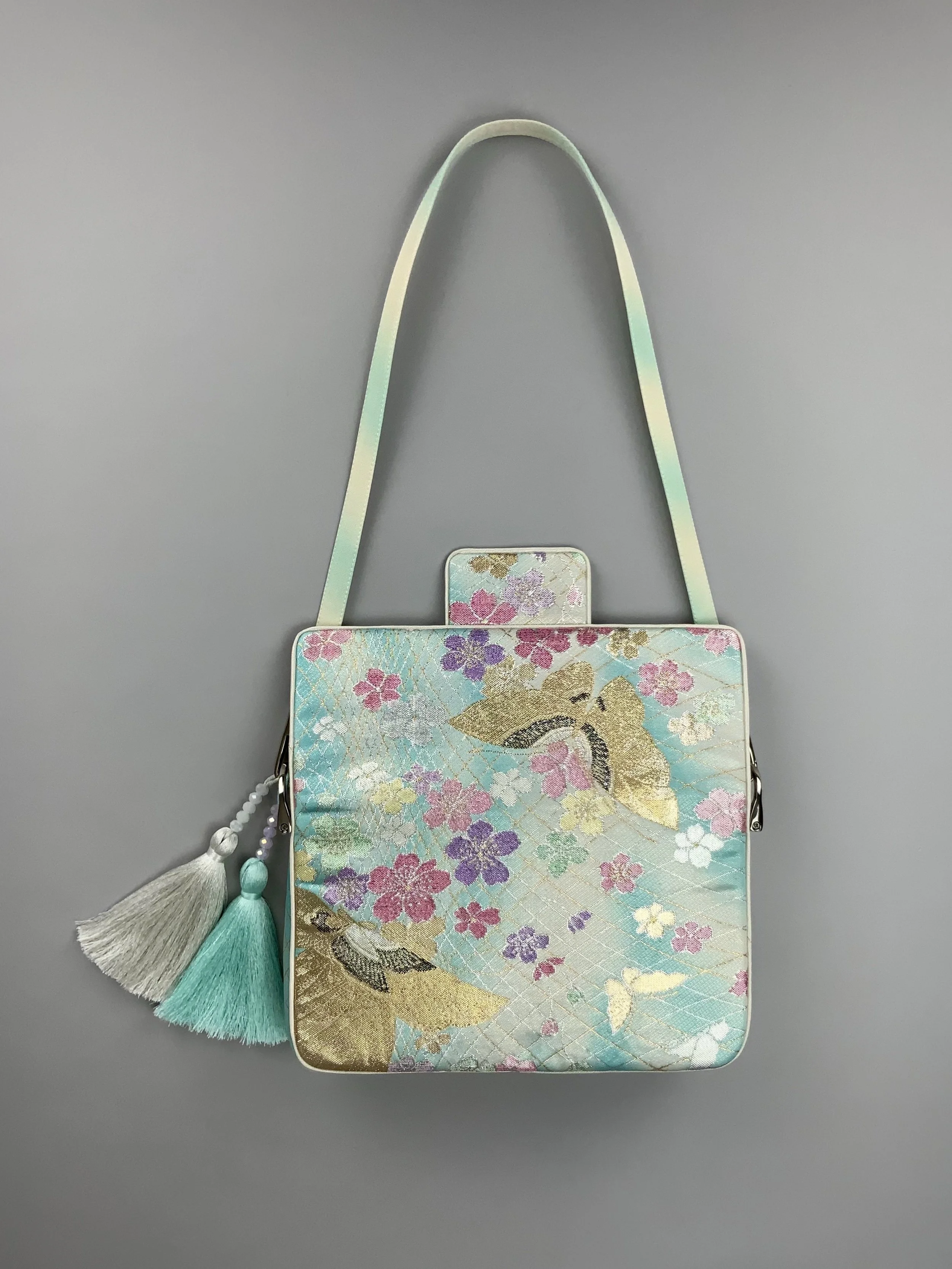 Aqua blue ombre evening bag made from vintage obi silk with pastel gold butterfly and blossom design by Kirsty Chivers