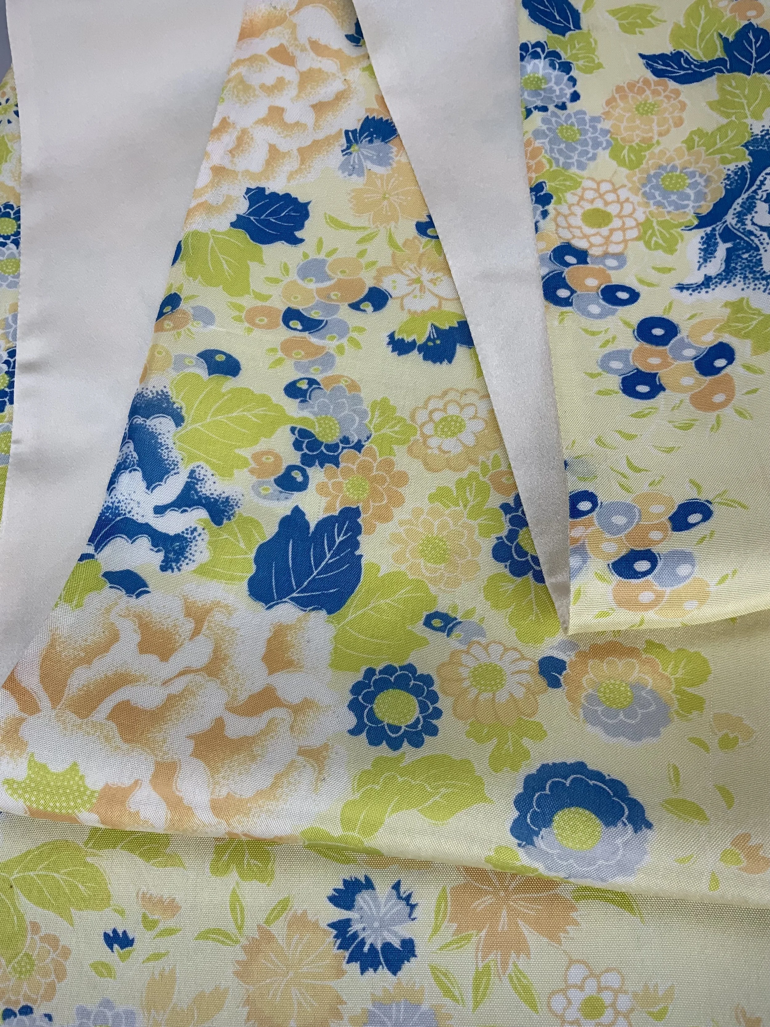 Closeup of yellow scarf with blossom print handmade from kimono fabric and silk satin by Kirsty Chivers