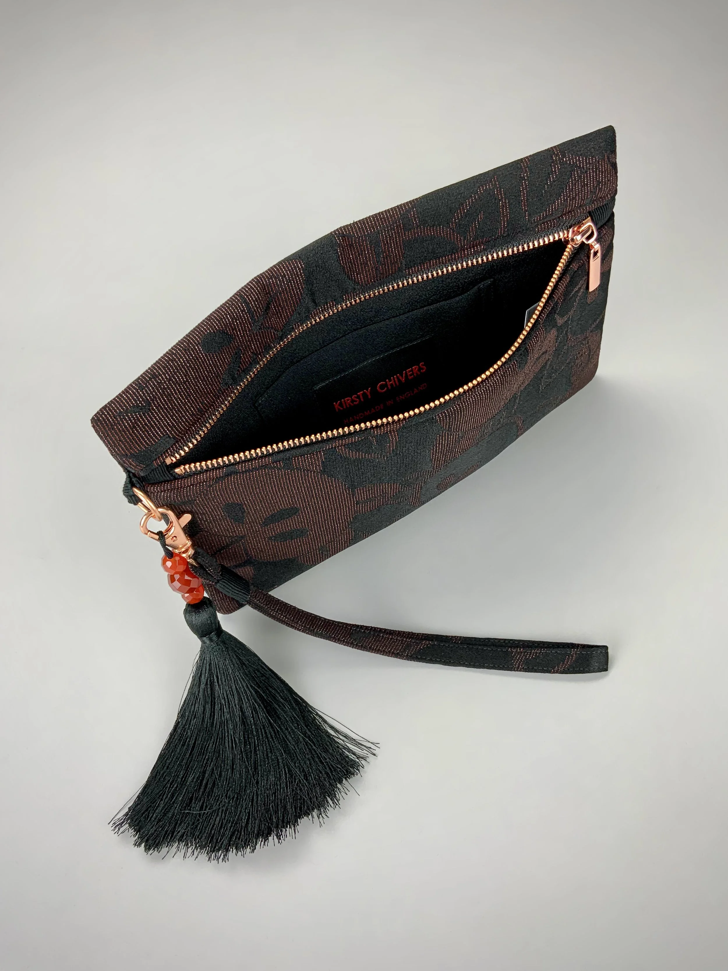 Interior of glittery black evening clutch with tassel made from vintage Japanese kimono silk