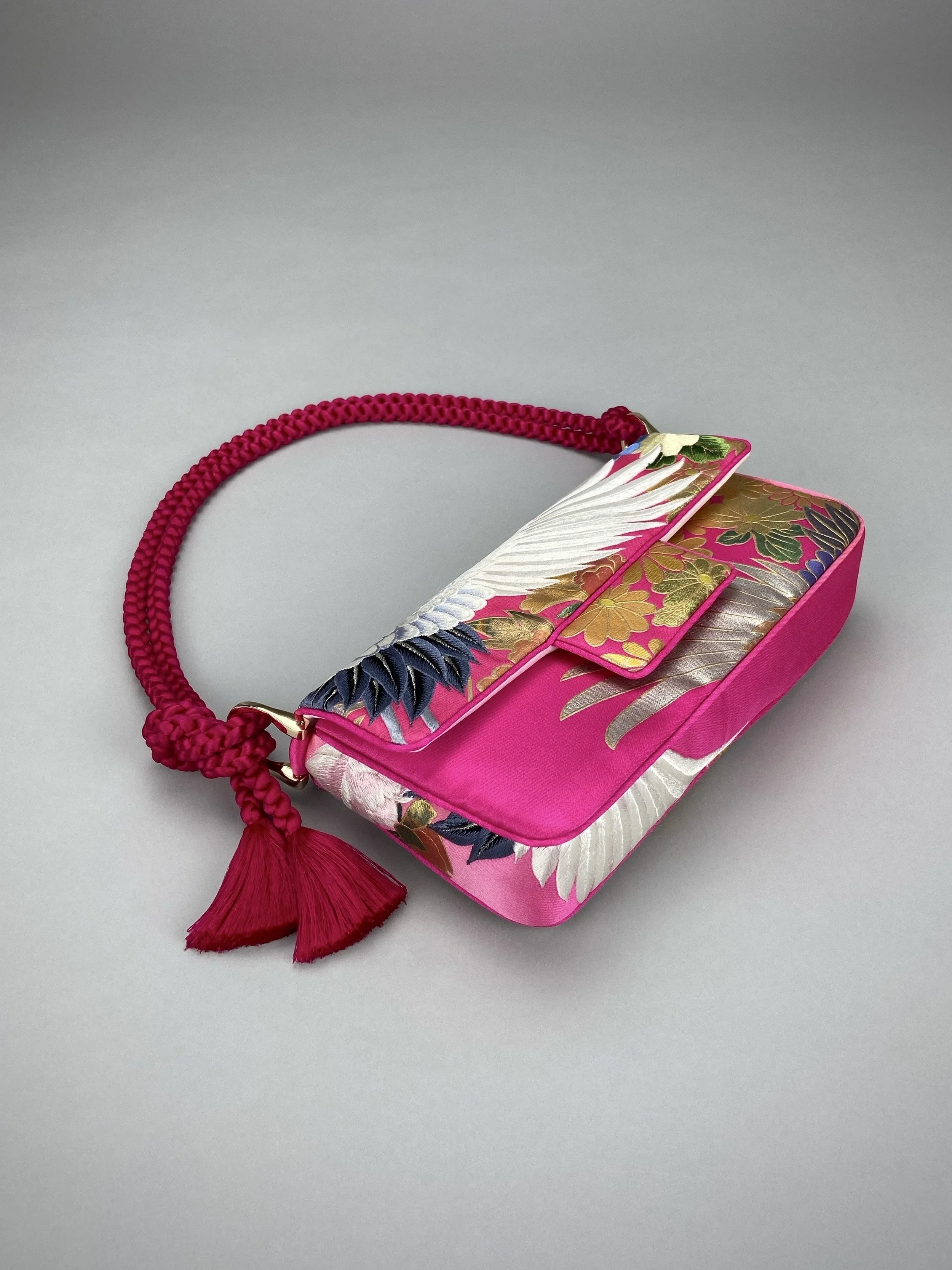 Cherry Pink Crane Feather baguette bag, handmade from vintage Japanese kimono silk with tasseled obijime cord strap by Kirsty Chivers
