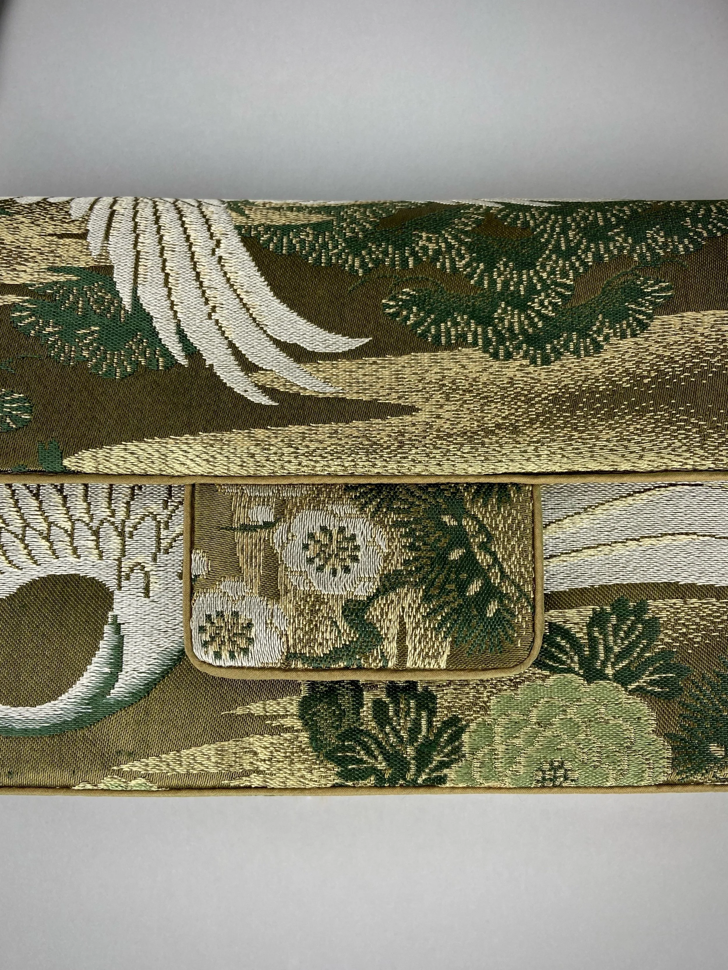 Unique Flying Crane baguette bag, handmade from vintage Japanese obi silk with gold hardware and matching silk tassel charm by Kirsty Chivers
