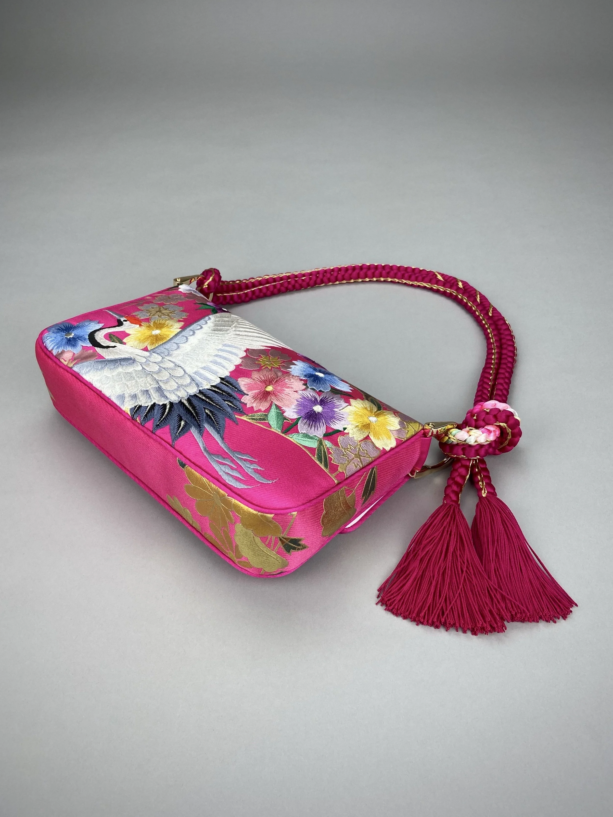 Cherry Pink Blossom & Crane baguette bag, handmade from vintage Japanese kimono silk with tasseled obijime cord strap by Kirsty Chivers