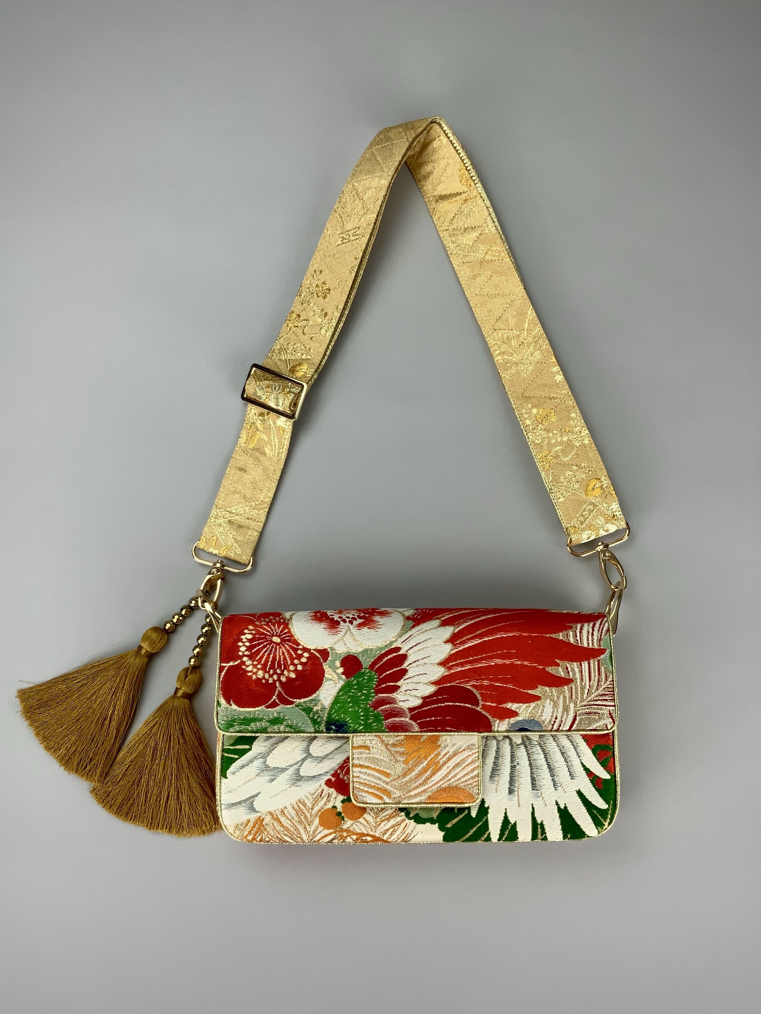 Unique evening bag in vintage obi silk with peacock, pine motifs & gold accents by Kirsty Chivers