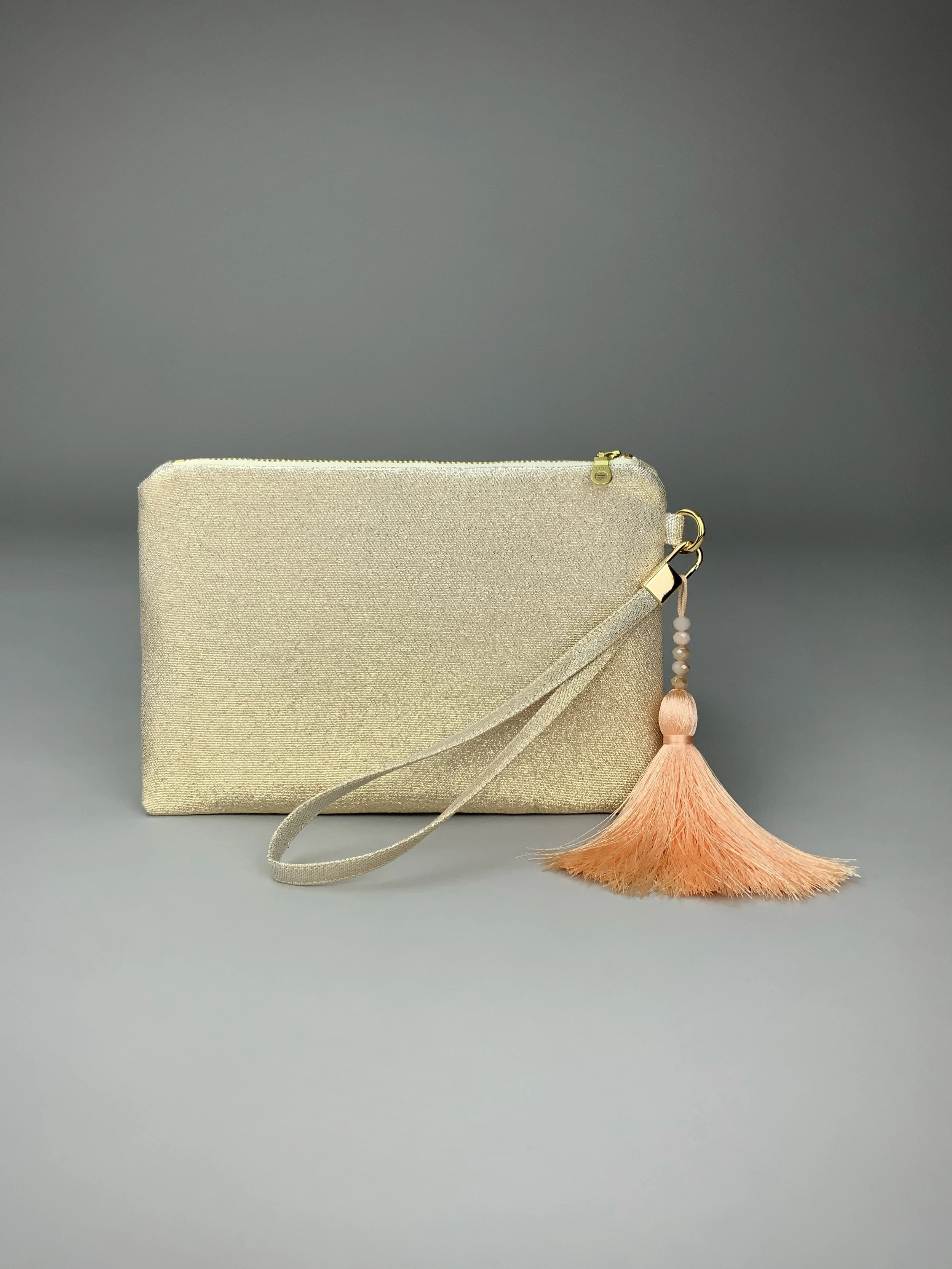 Wristlet purse made from repurposed vintage obi fabric with brushstroke pastel design and gold-silver threads