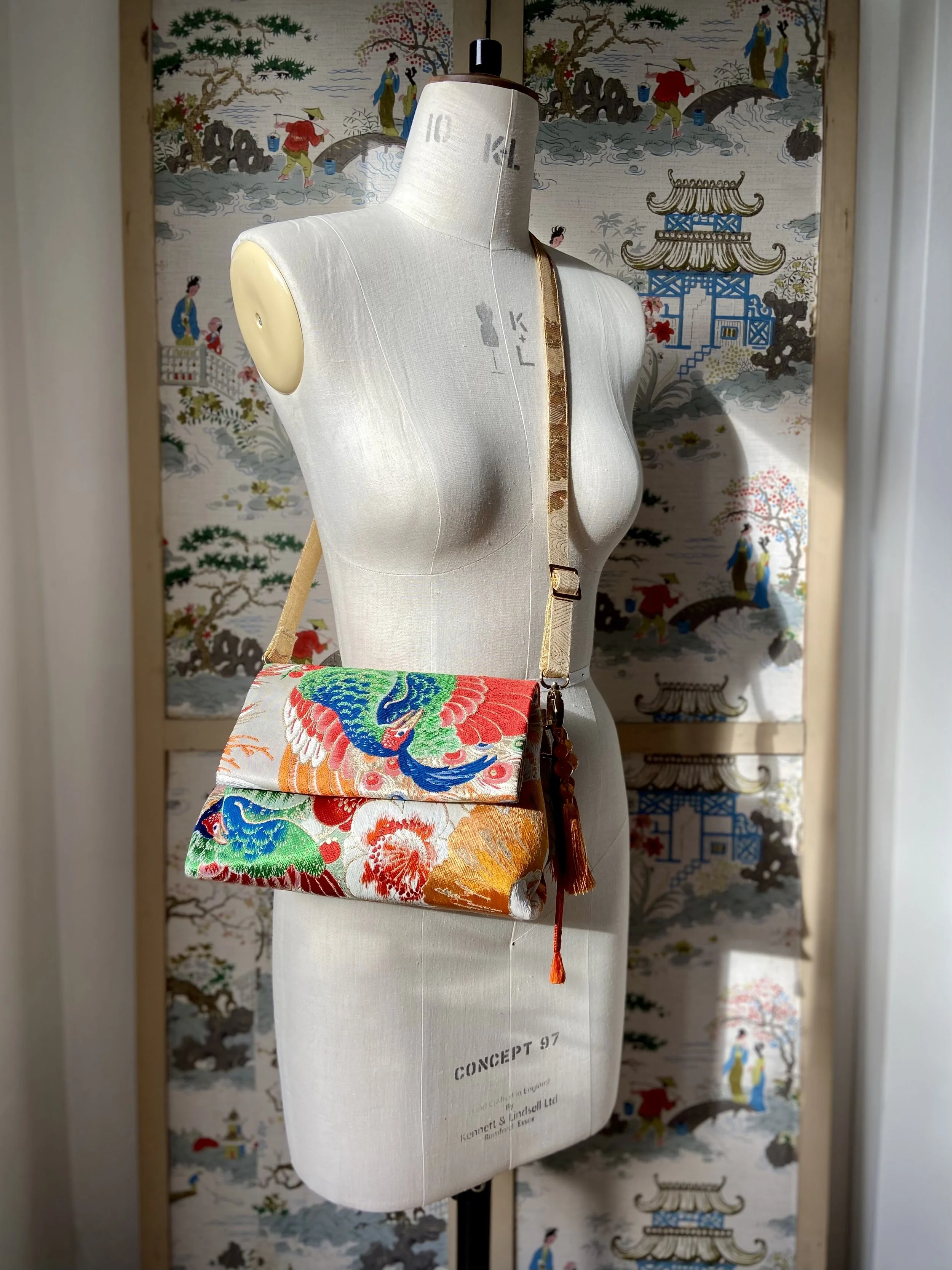 One-of-a-kind evening bag in vintage obi silk with peacock, pine motifs & gold accents