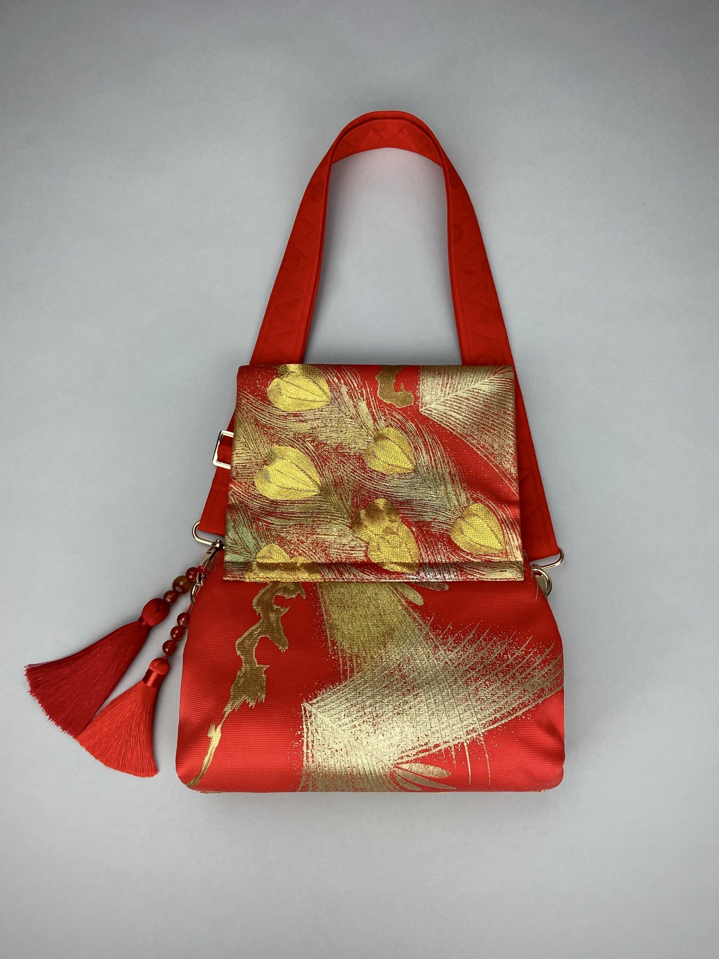 Vermillion red vintage kimono silk evening bag with gold Peacock feather design by Kirsty Chivers