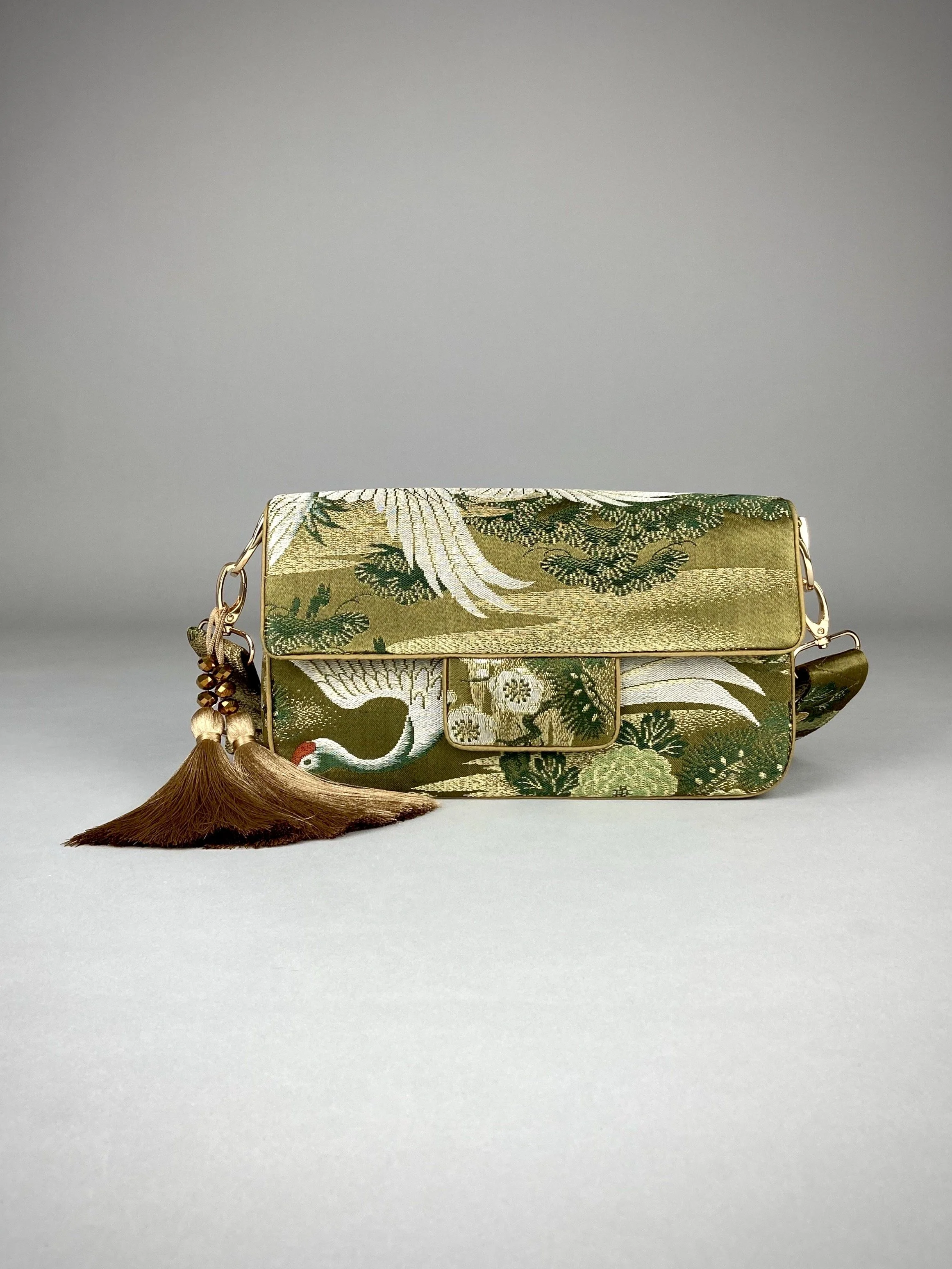 Unique Flying Crane baguette bag, handmade from vintage Japanese obi silk with gold hardware and matching silk tassel charm by Kirsty Chivers