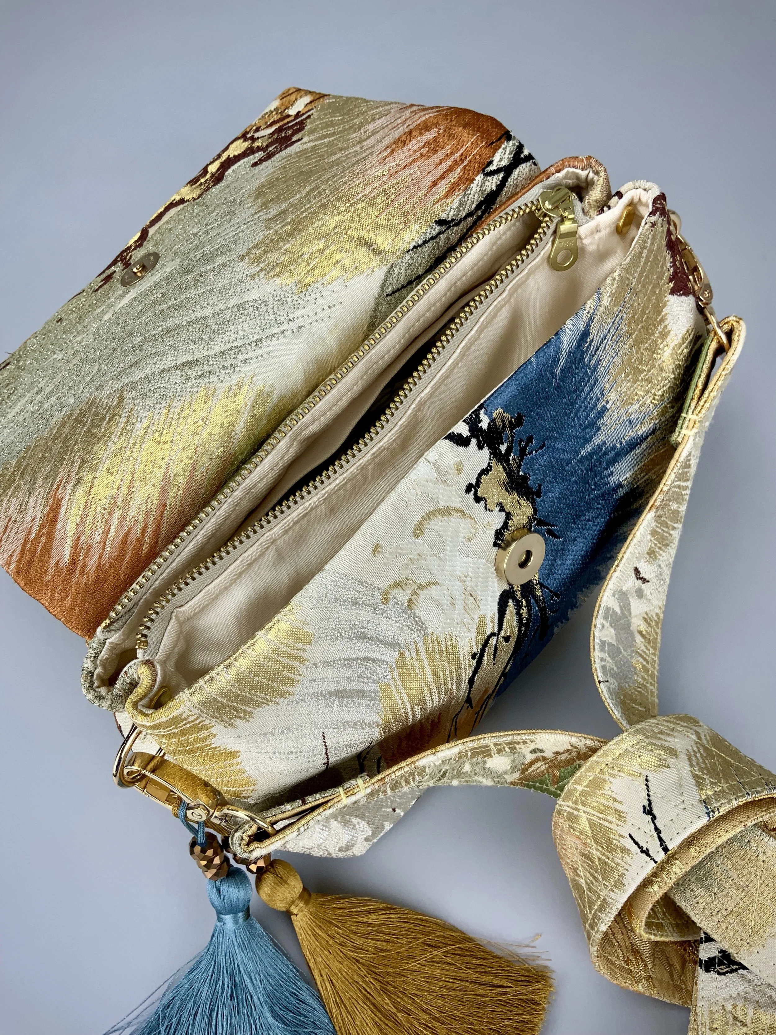 Metallic gold evening bag with Matsu pine and blossom design, made from vintage obi silk by Kirsty Chivers
