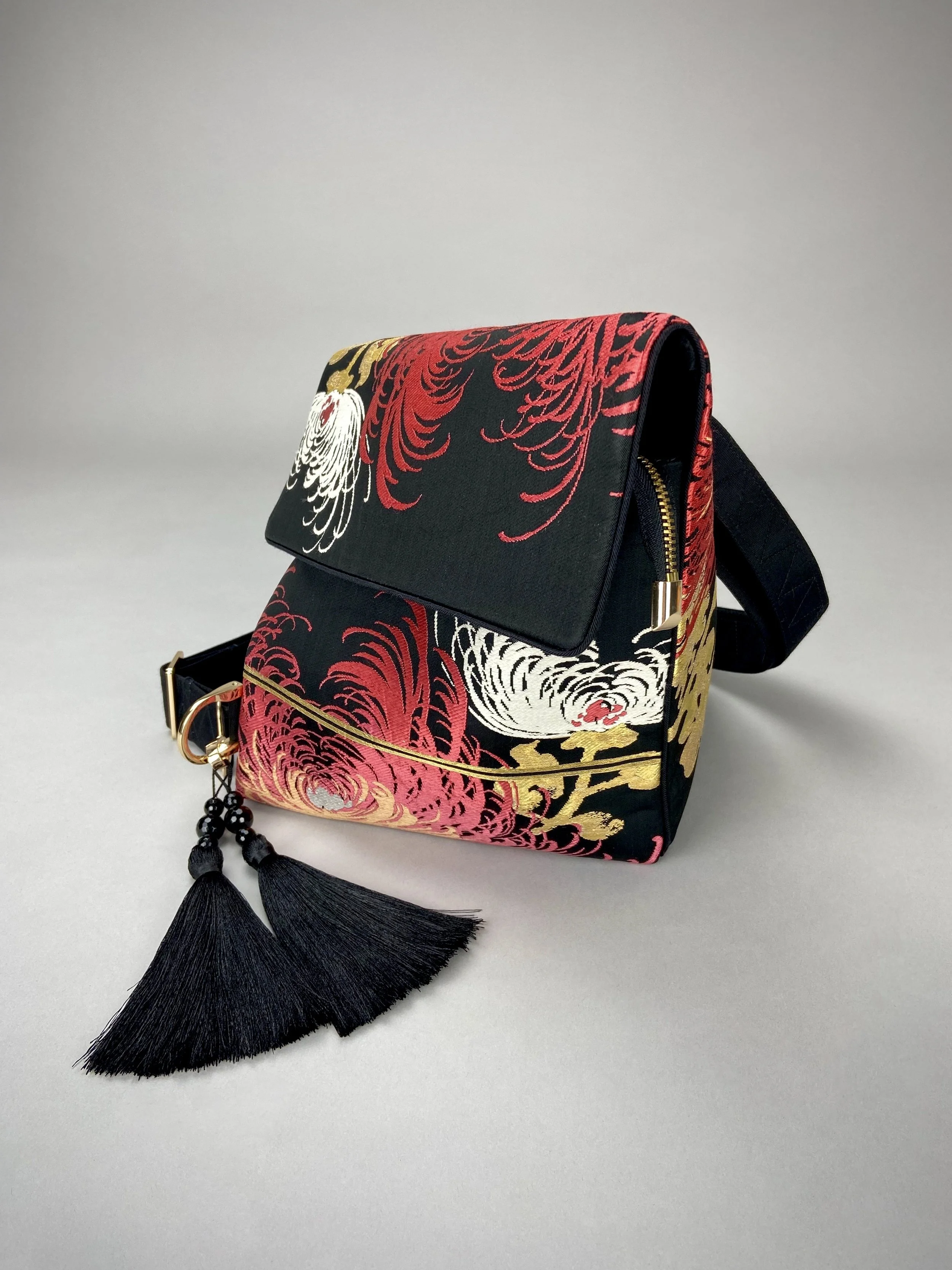 Black and crimson Chrysanthemum vintage obi silk shoulder bag with gold thread detail and black silk tassel charm by Kirsty Chivers