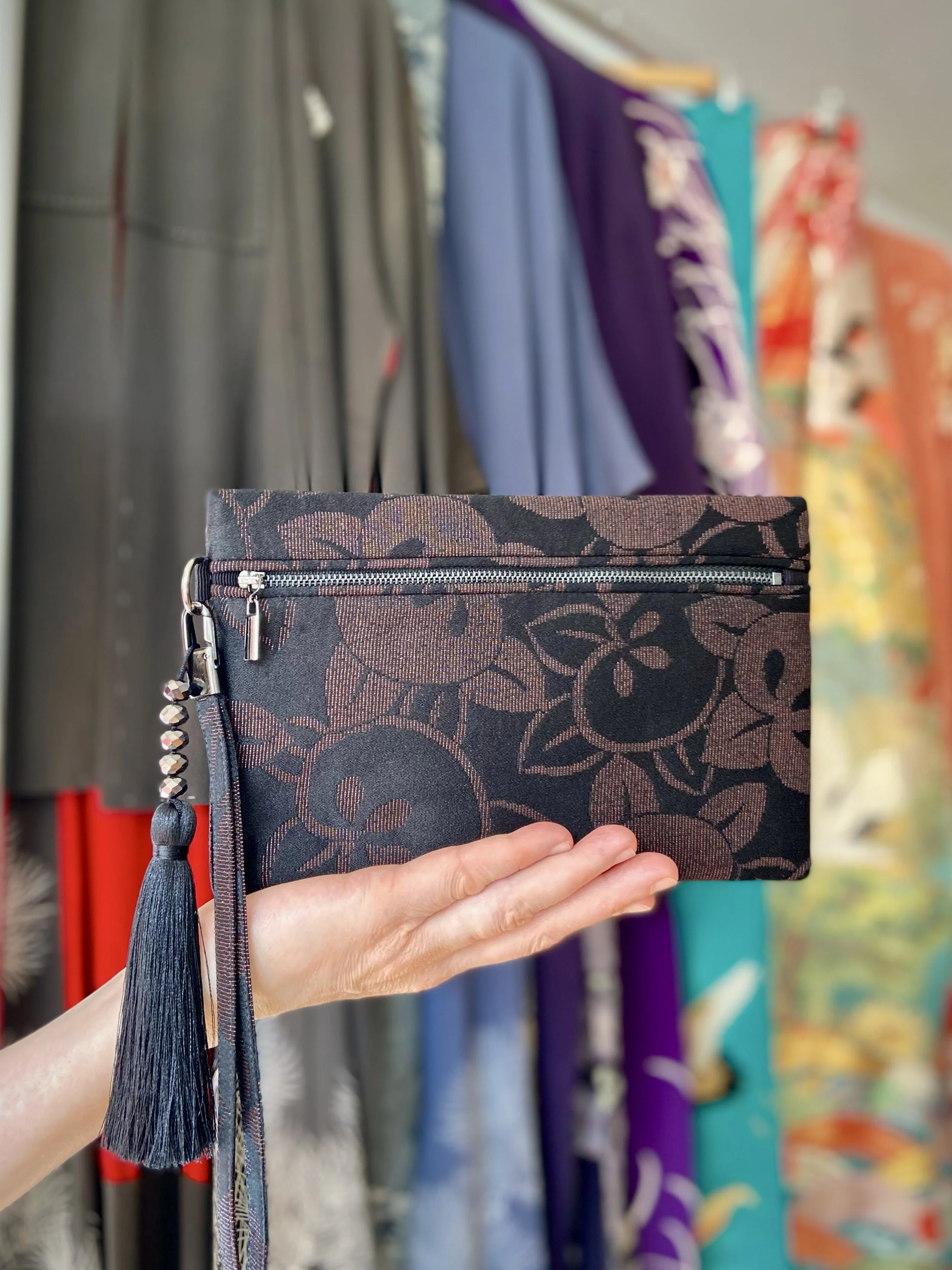 Glittery black wristlet clutch purse with tassel, handmade from vintage Japanese kimono silk