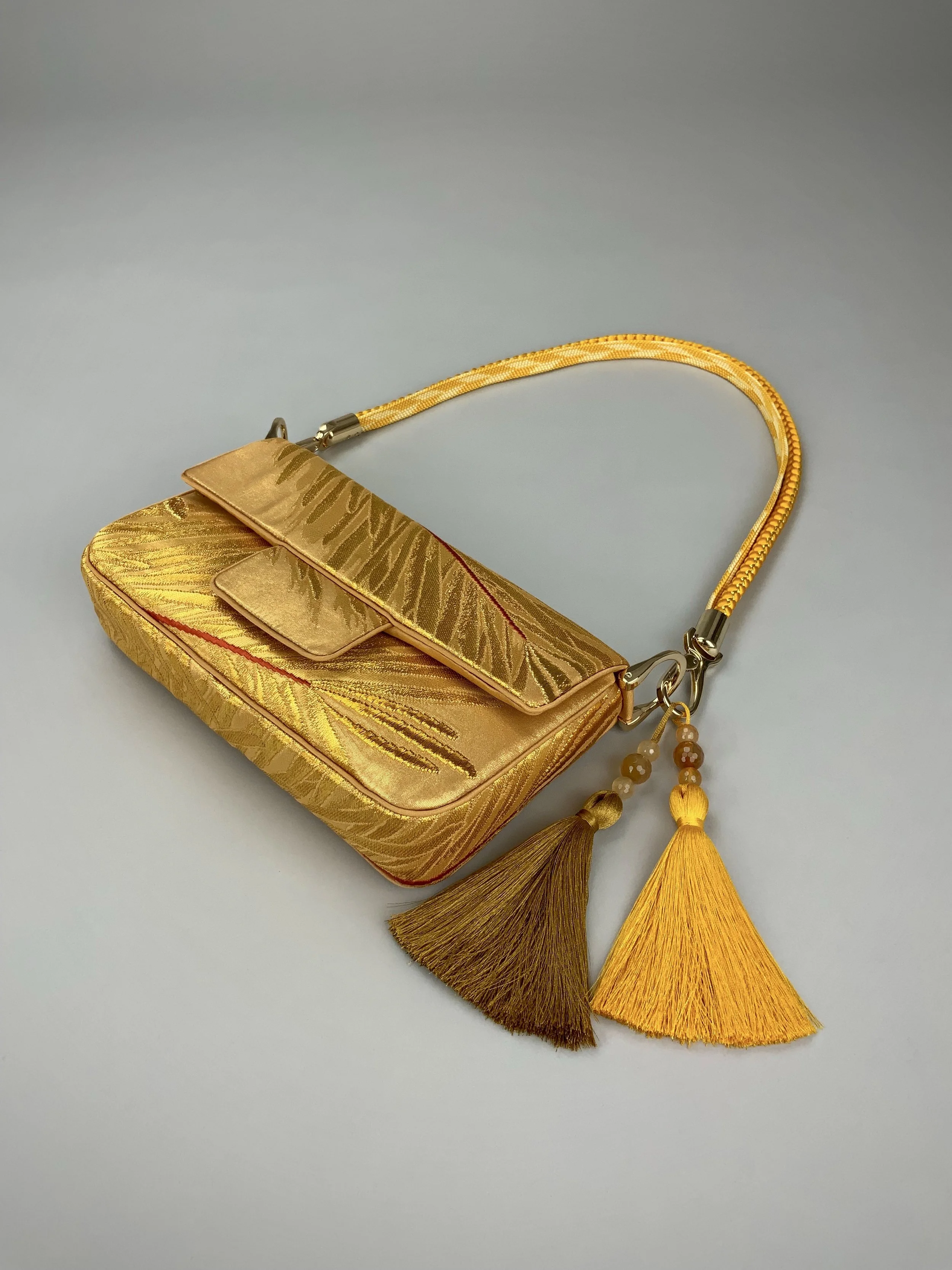 Lustrous metallic gold baguette evening bag made from vintage Japanese obi silk by Kirsty Chivers