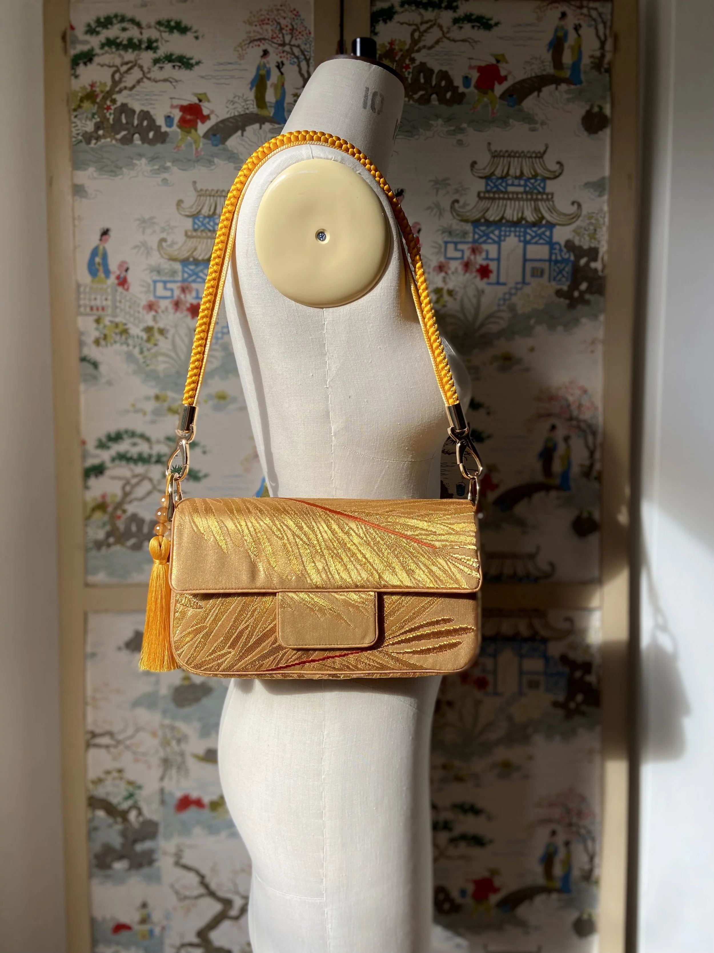 Lustrous metallic gold baguette evening bag made from vintage Japanese obi silk by Kirsty Chivers