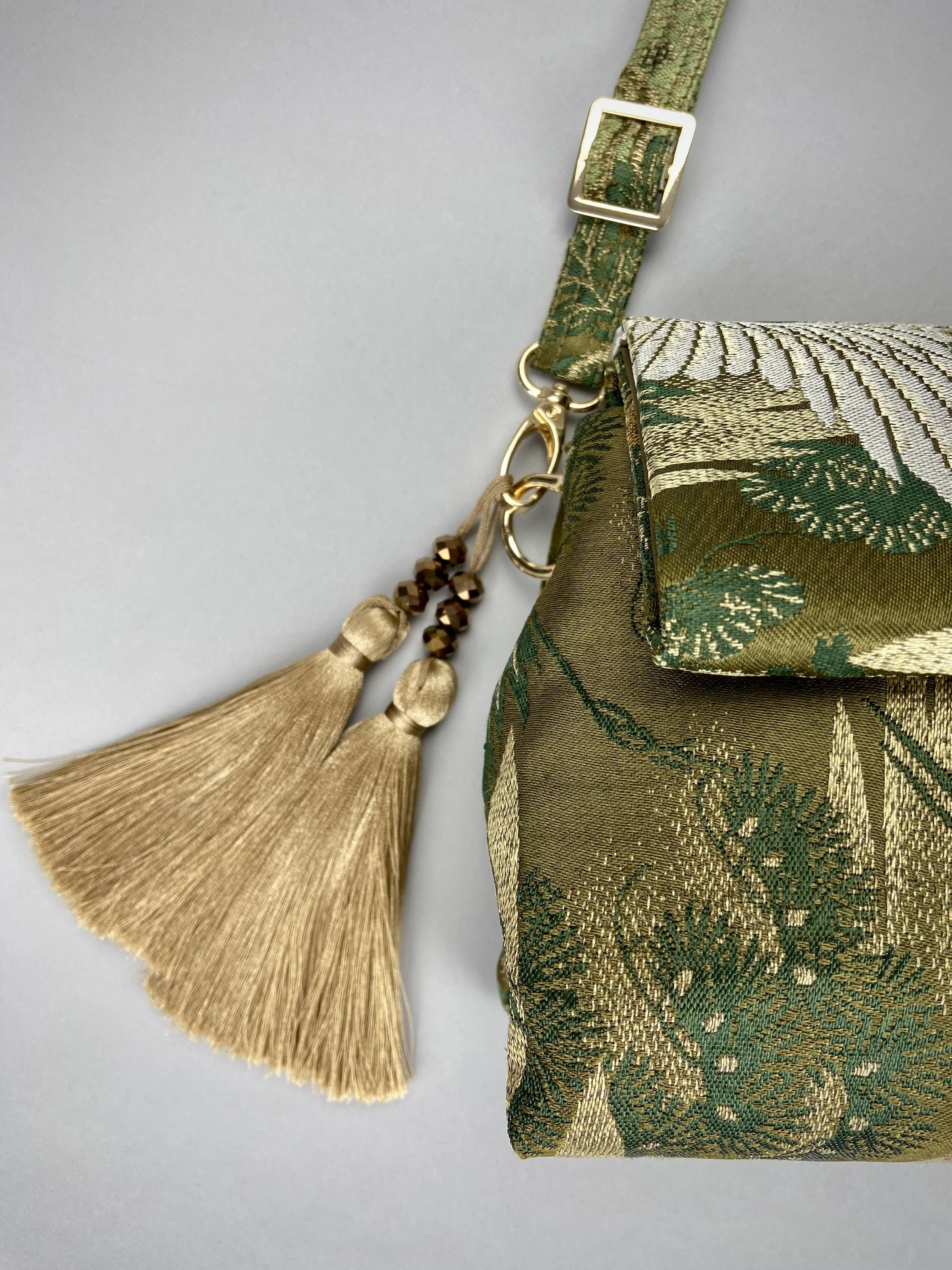 Green Flying Crane evening bag, made from repurposed vintage Japanese obi silk by Kirsty Chivers