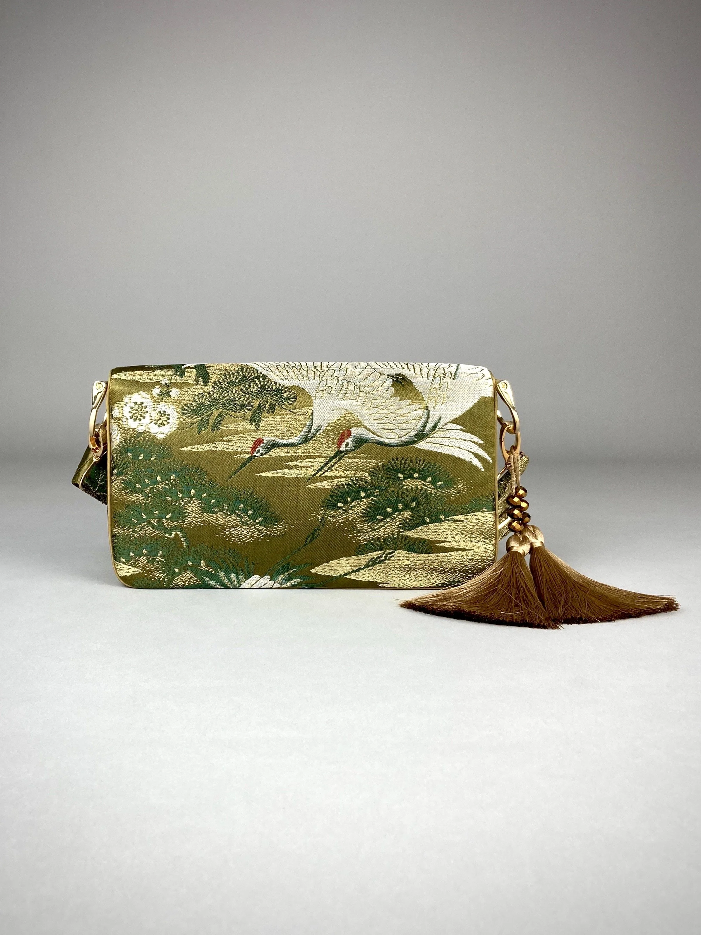 Unique Flying Crane baguette bag, handmade from vintage Japanese obi silk with gold hardware and matching silk tassel charm by Kirsty Chivers