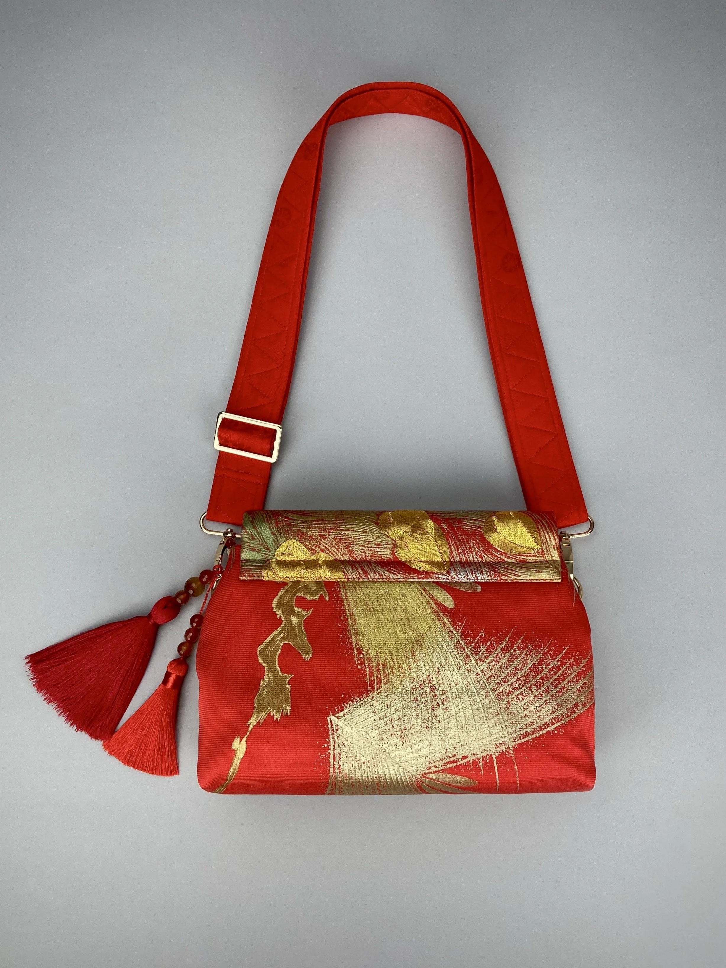 Vermillion red vintage kimono silk evening bag with gold Peacock feather design by Kirsty Chivers