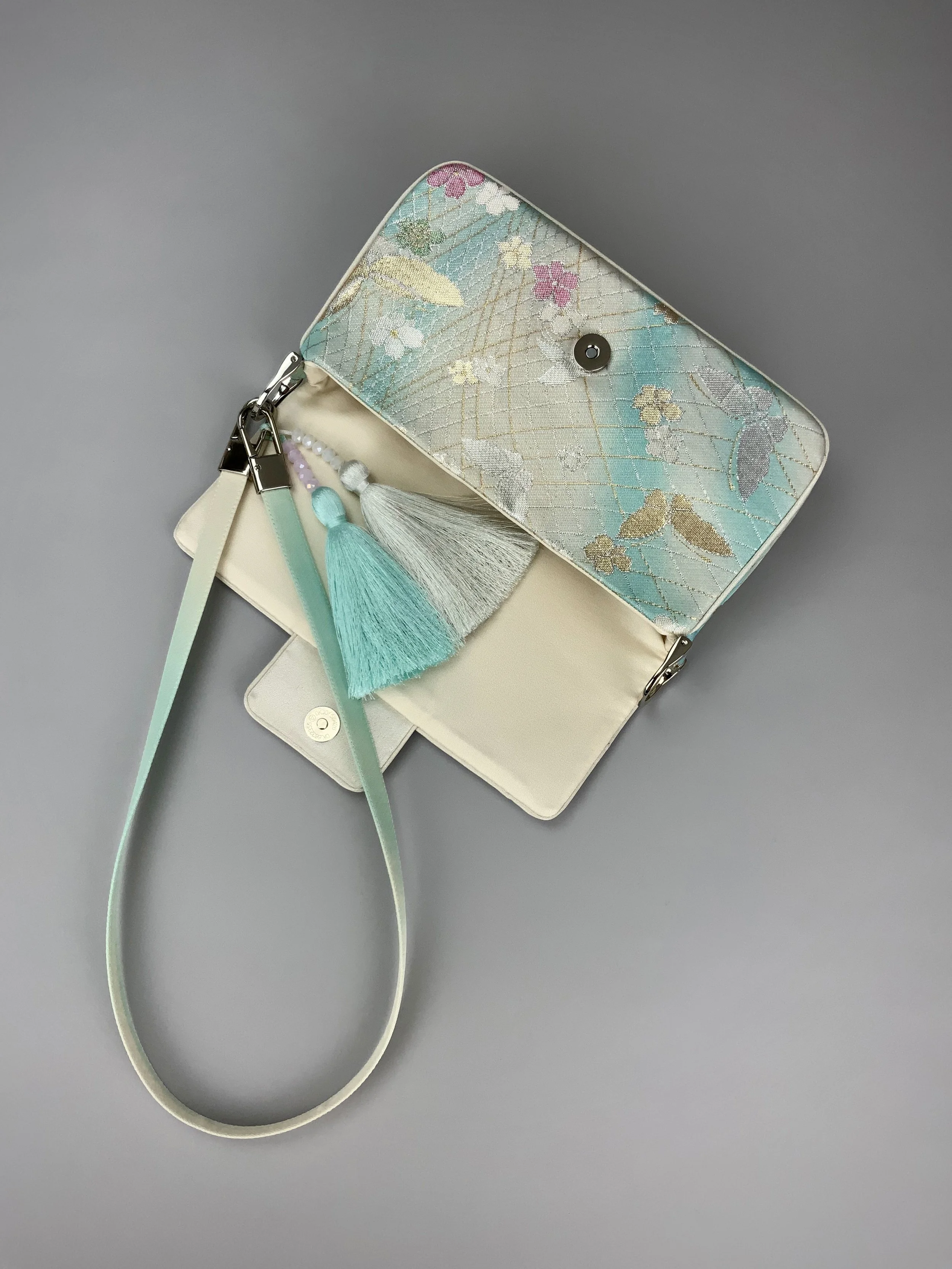 Aqua ombre evening bag made from vintage obi silk with pastel gold butterfly and blossom design by Kirsty Chivers