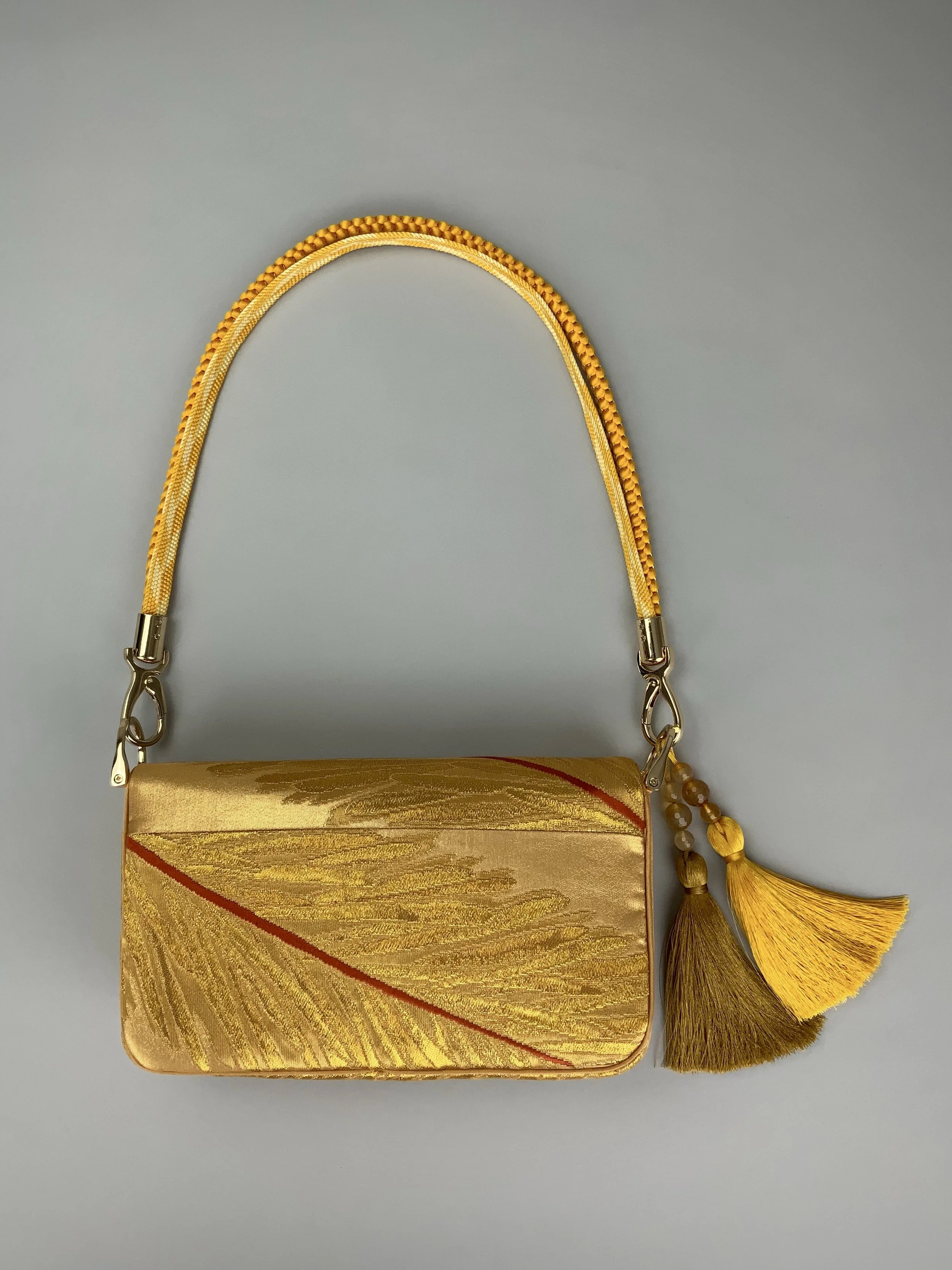 Lustrous metallic gold baguette evening bag made from vintage Japanese obi silk by Kirsty Chivers