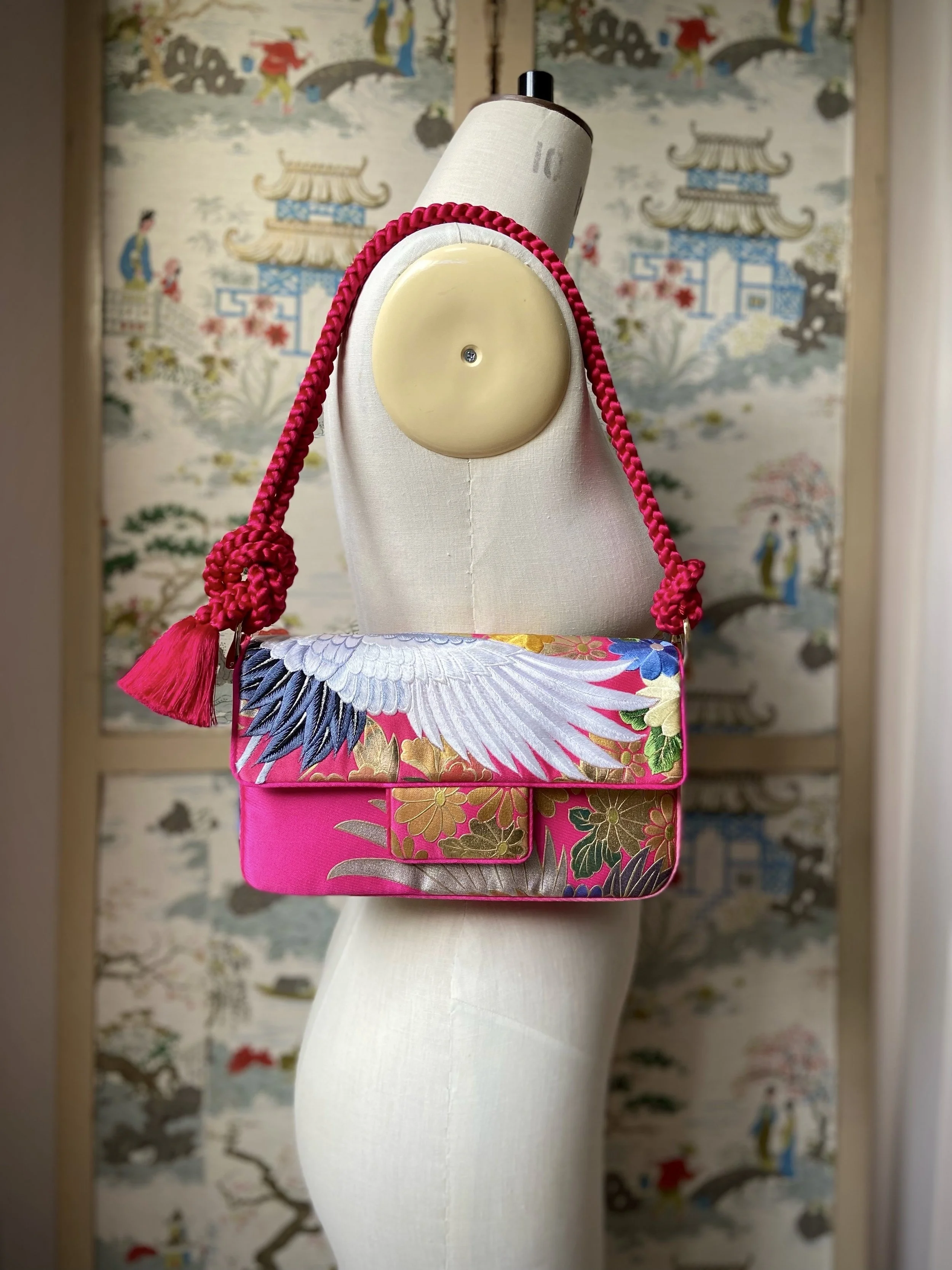 Cherry Pink Crane Feather baguette bag, handmade from vintage Japanese kimono silk with tasseled obijime cord strap by Kirsty Chivers