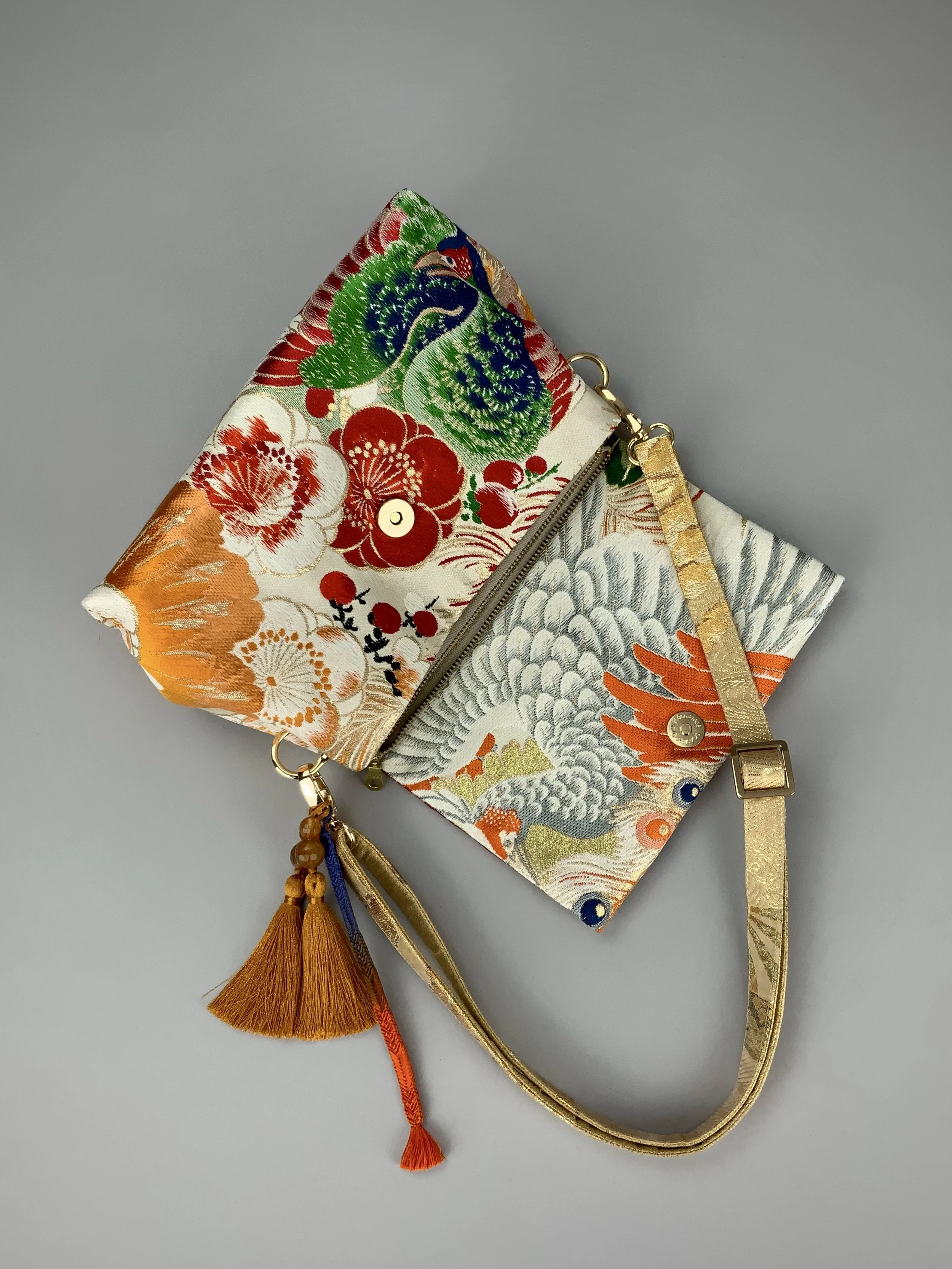 One-of-a-kind evening bag in vintage obi silk with peacock, pine motifs & gold accents