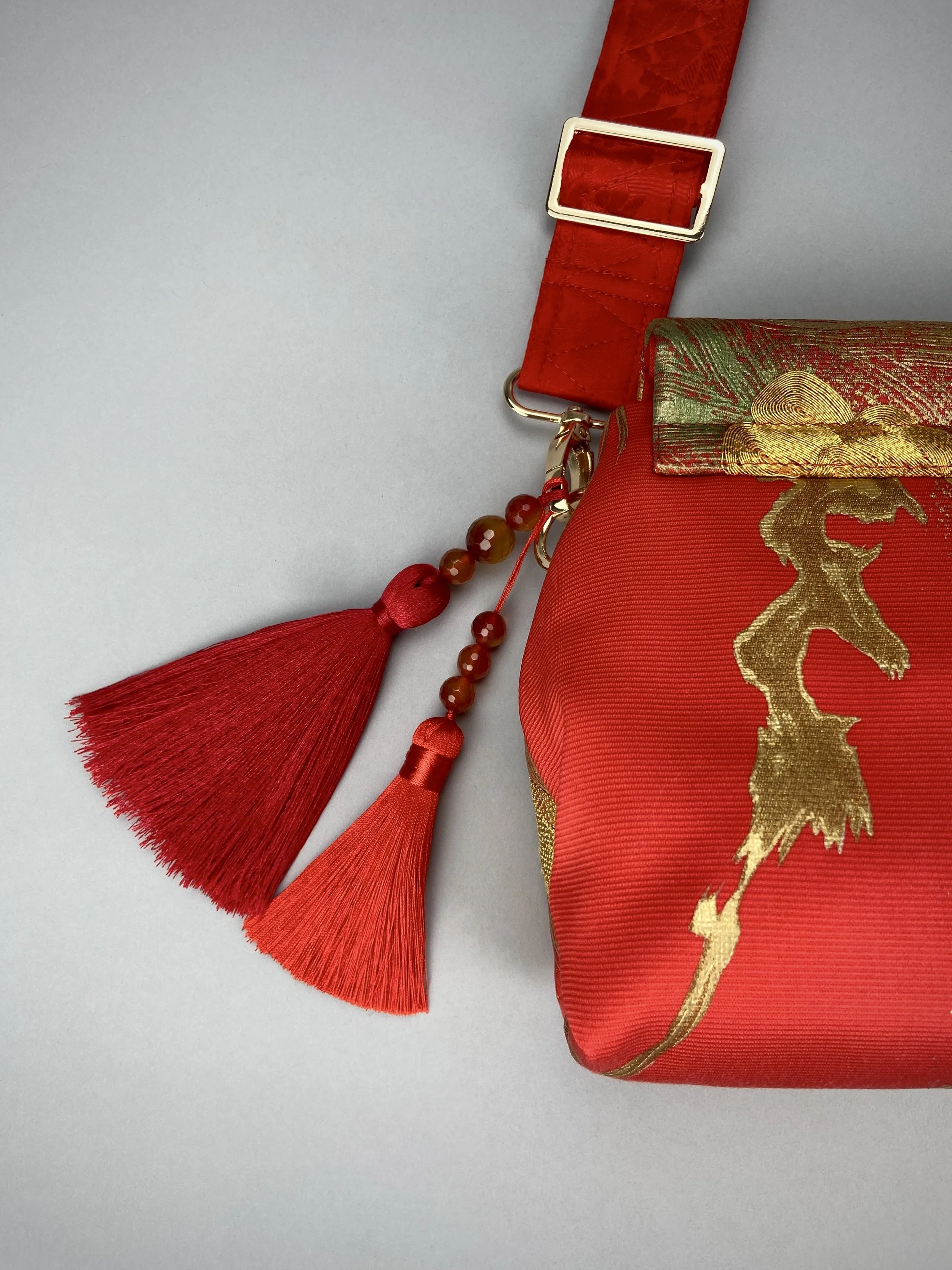 Vermillion red vintage kimono silk evening bag with gold Peacock feather design by Kirsty Chivers