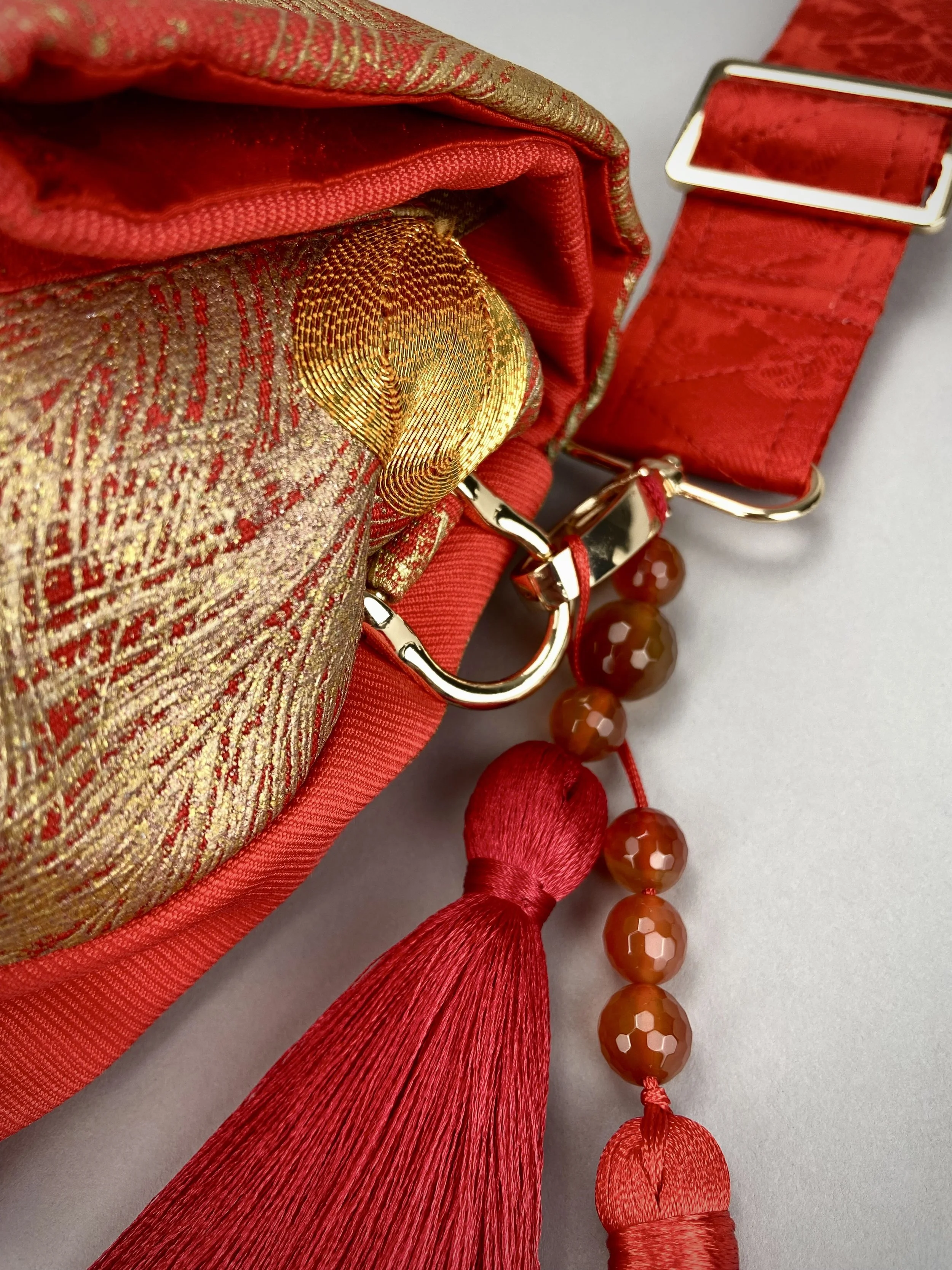 Vermillion red vintage kimono silk evening bag with gold Peacock feather design by Kirsty Chivers