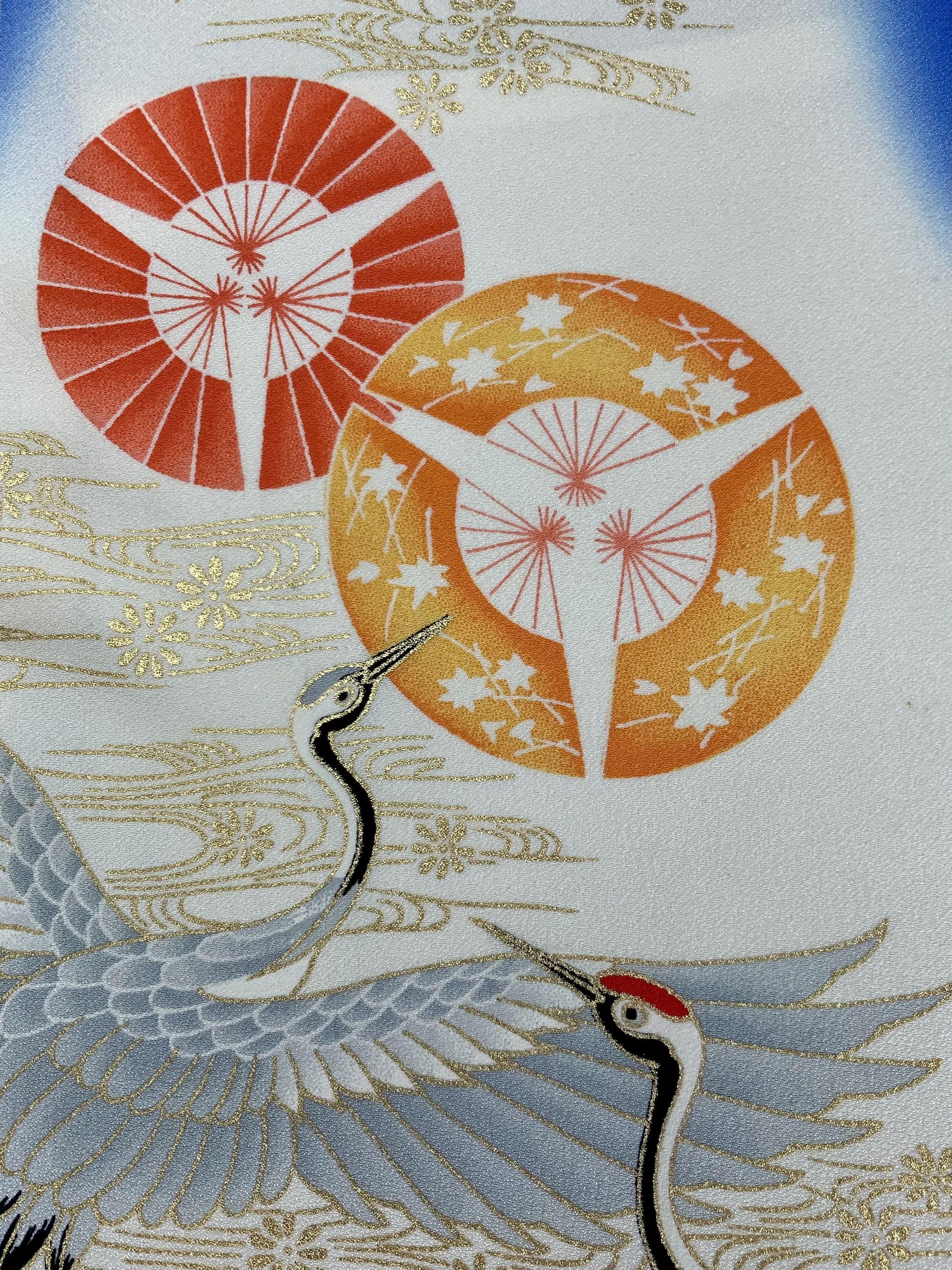 Closeup of electric blue silk scarf with Flying Crane print handmade by Kirsty Chivers