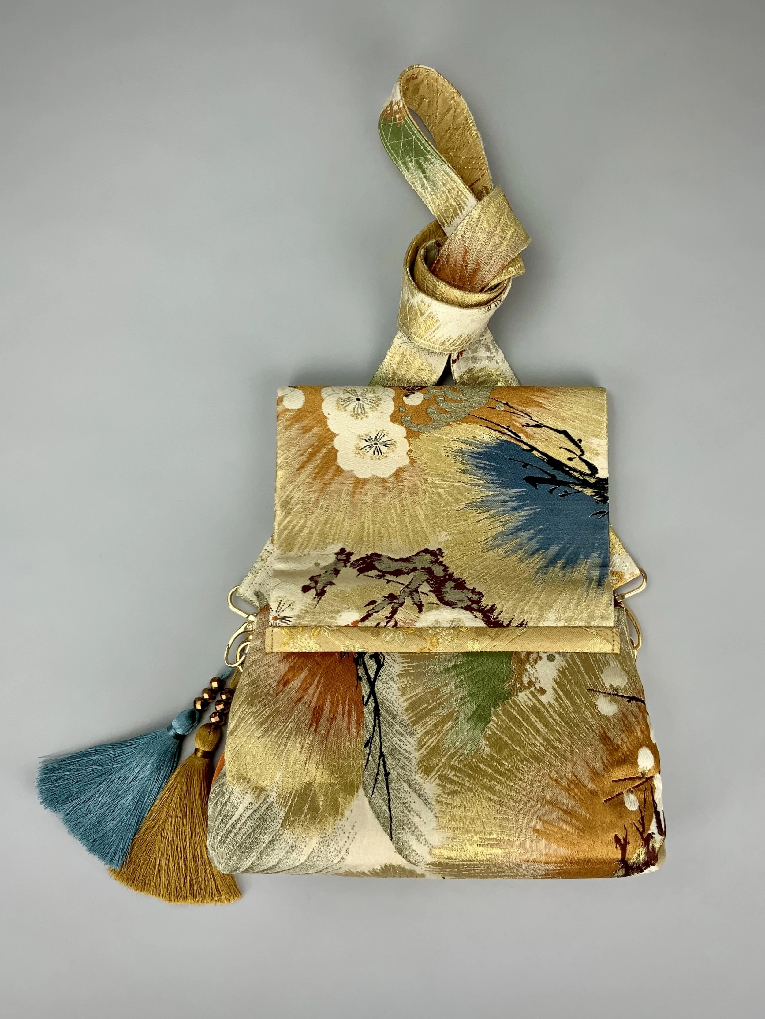 Metallic gold evening bag with Matsu pine and blossom design, made from vintage obi silk by Kirsty Chivers